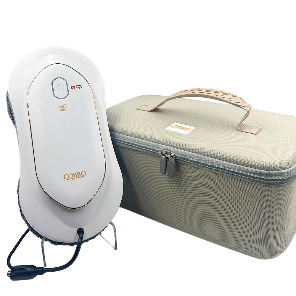 Biało-złoty czyścik do okien i beżowa walizka. Czyścik ma przewód zasilający, a walizka uchwyt.