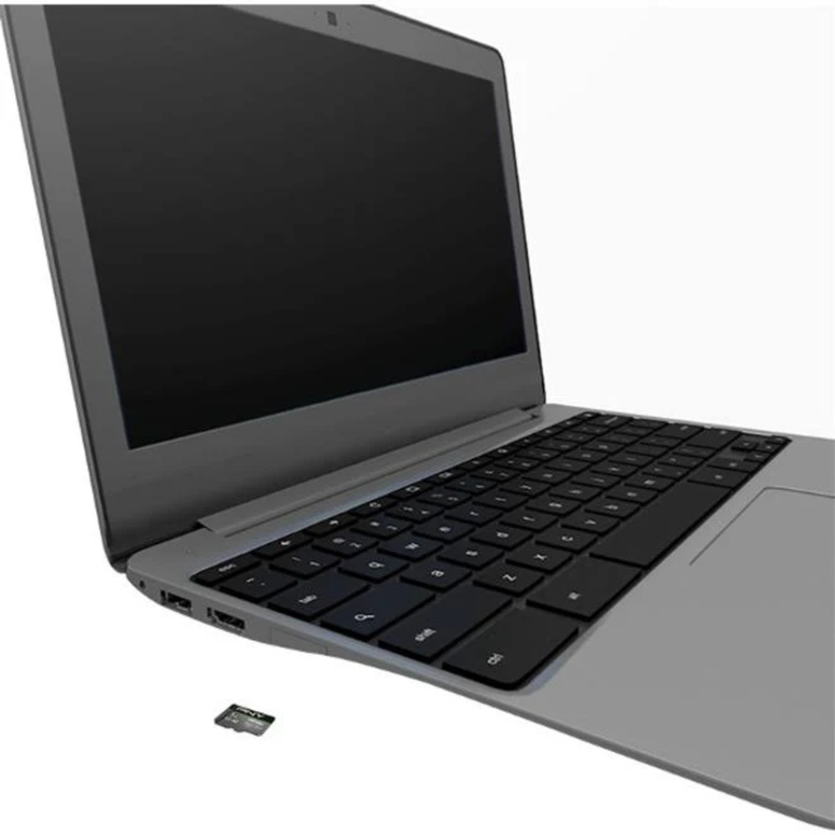 Un portátil gris con teclado y pantalla negros. Una pequeña tarjeta SD está cerca del portátil.
