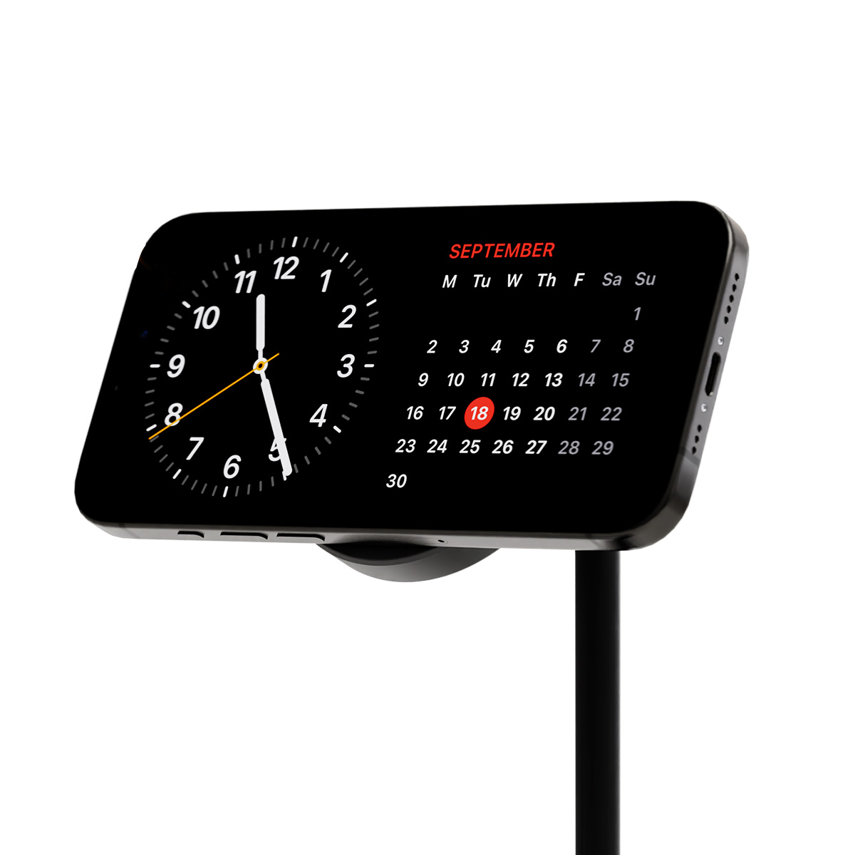 Un dispositivo negro muestra un reloj y un calendario de septiembre. La fecha resaltada es el 18. El dispositivo está sobre un soporte.
