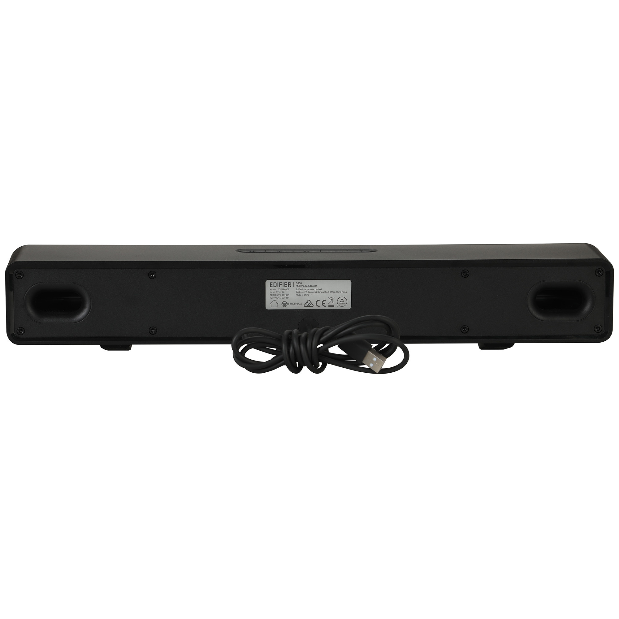 Czarny soundbar na białej powierzchni. Ma etykietę i kabel USB.