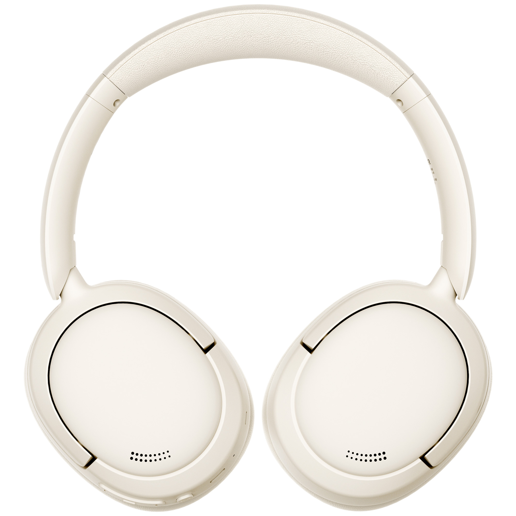 Kremowe słuchawki. Konstrukcja nauszna z wyściełanym pałąkiem i nausznicami. Nausznice mają małe otwory.