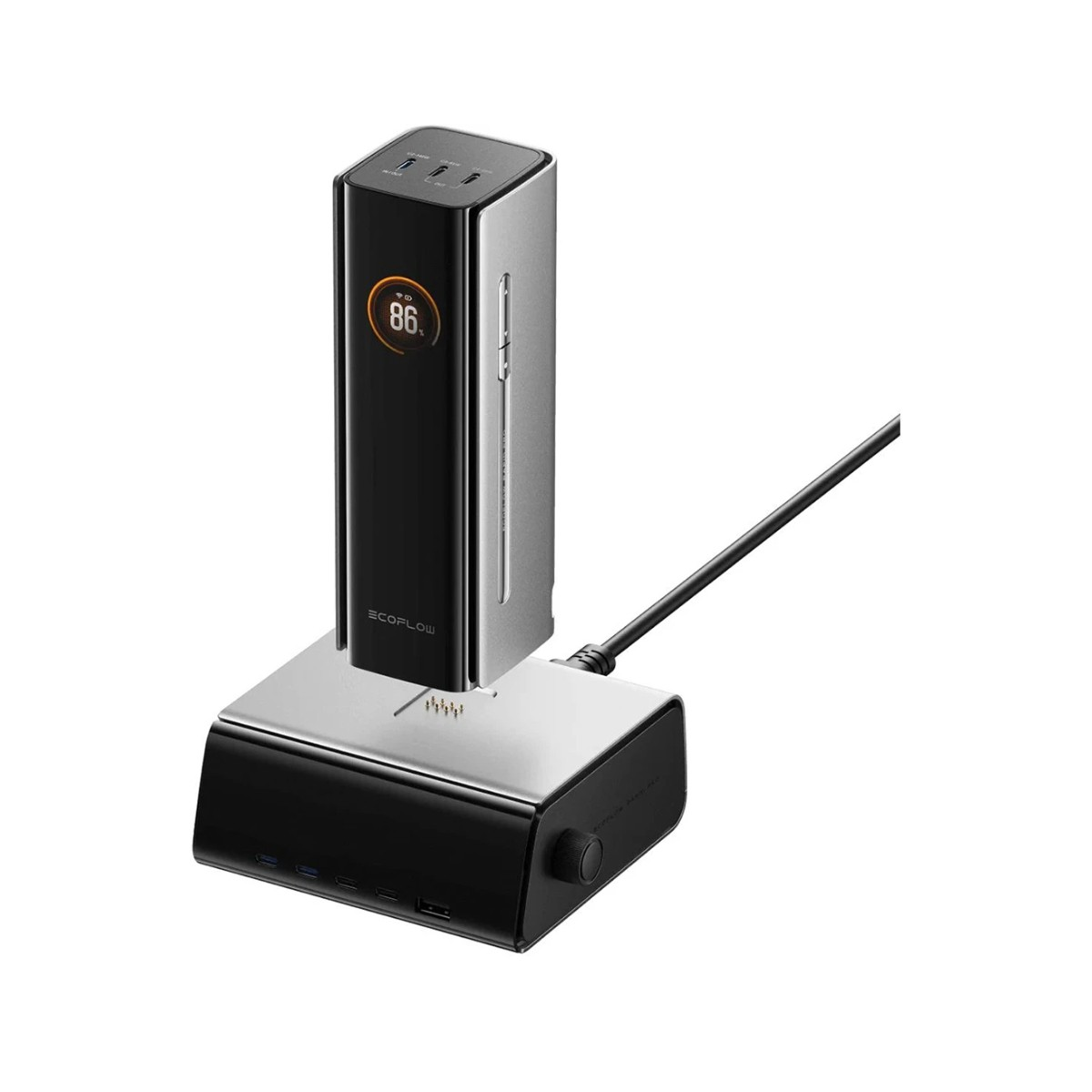 Czarno-srebrna stacja zasilania z cyfrowym wyświetlaczem pokazującym 86%. Znajduje się na czarnej podstawie ze srebrną górą. Podłączony jest czarny kabel.