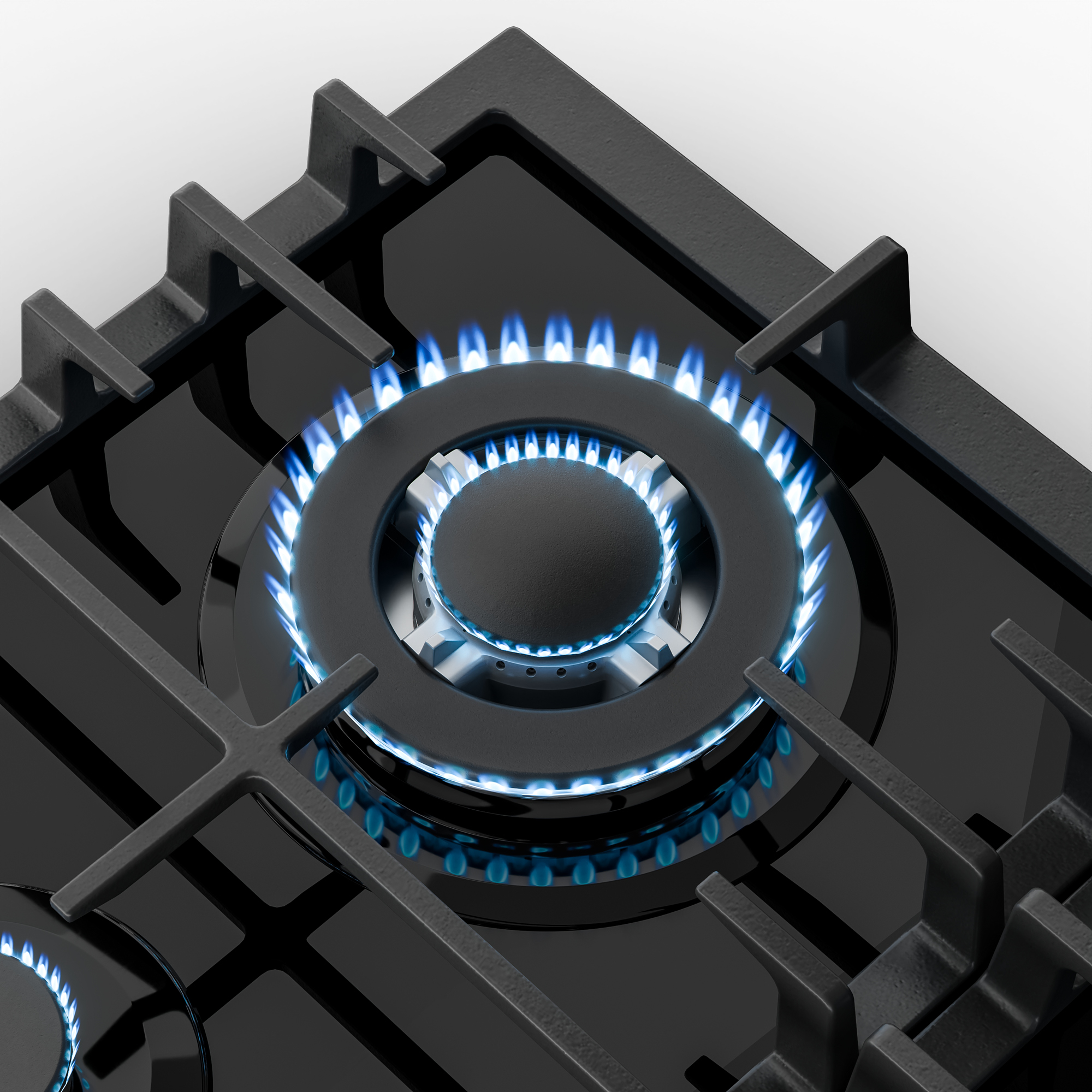 Primer plano de una estufa de gas negra con llamas azules. El quemador está encendido, rodeado de rejillas negras.