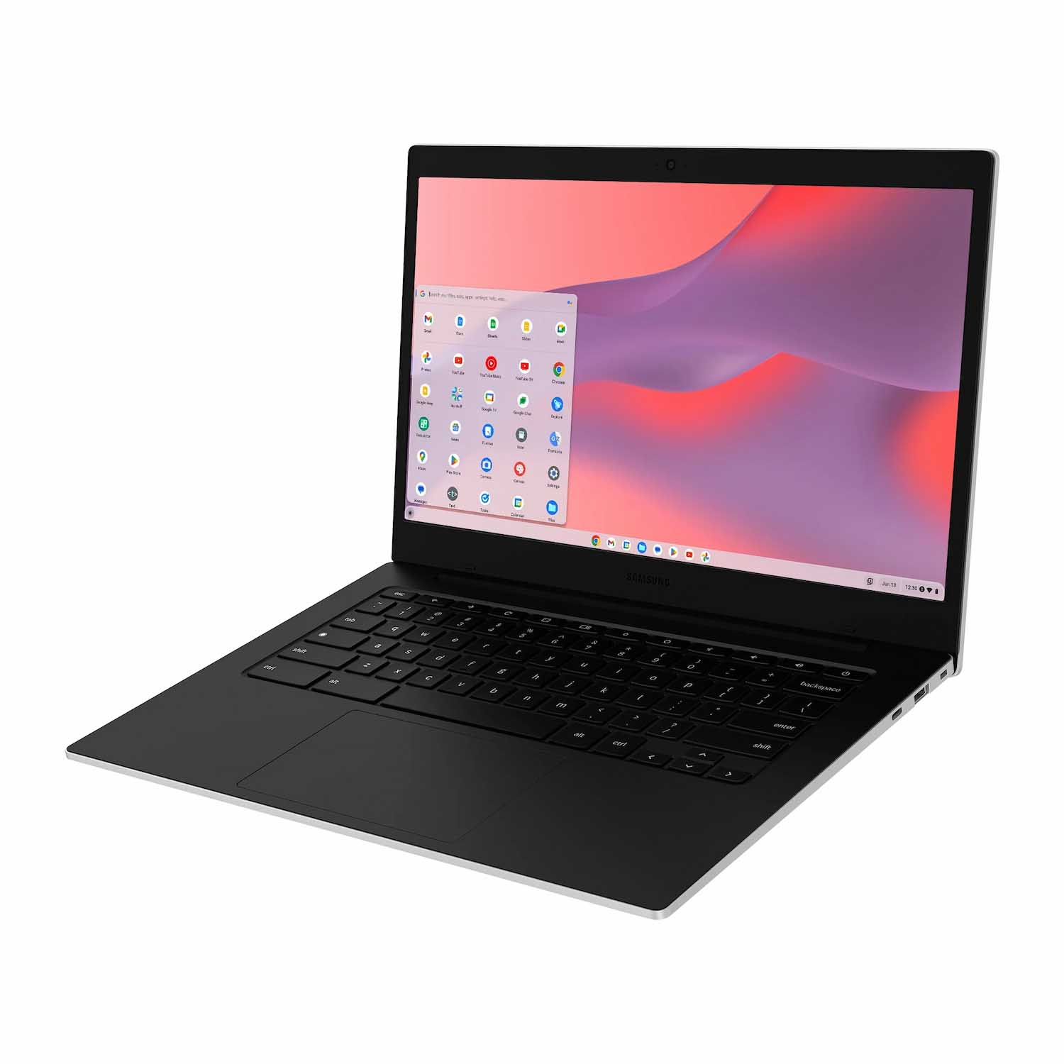 Una laptop Samsung está abierta, mostrando un menú de aplicaciones. La pantalla muestra un fondo rosa y morado. El teclado es negro.