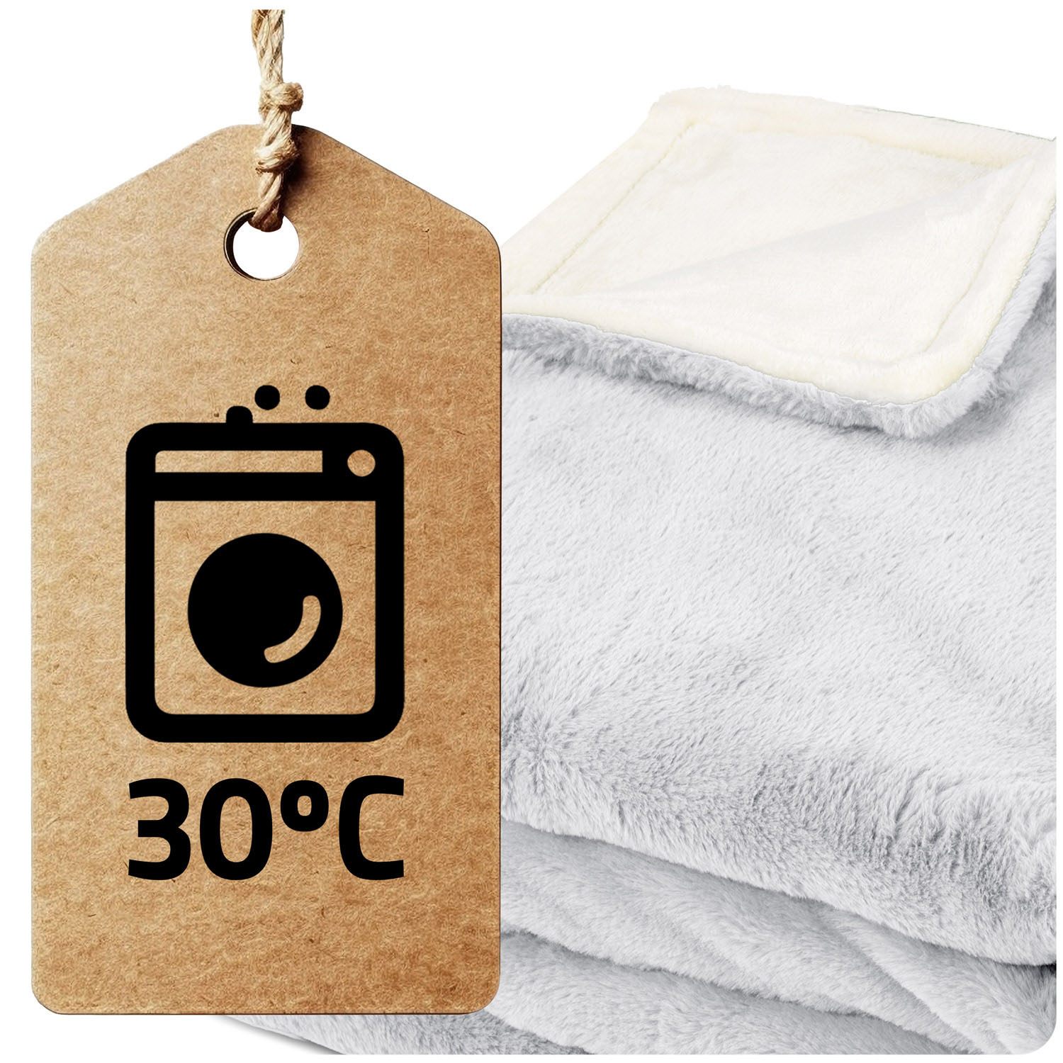 Etykieta pokazuje symbol prania i 30°C. Obok złożony jest szary, puszysty koc z białą, miękką warstwą wewnętrzną.