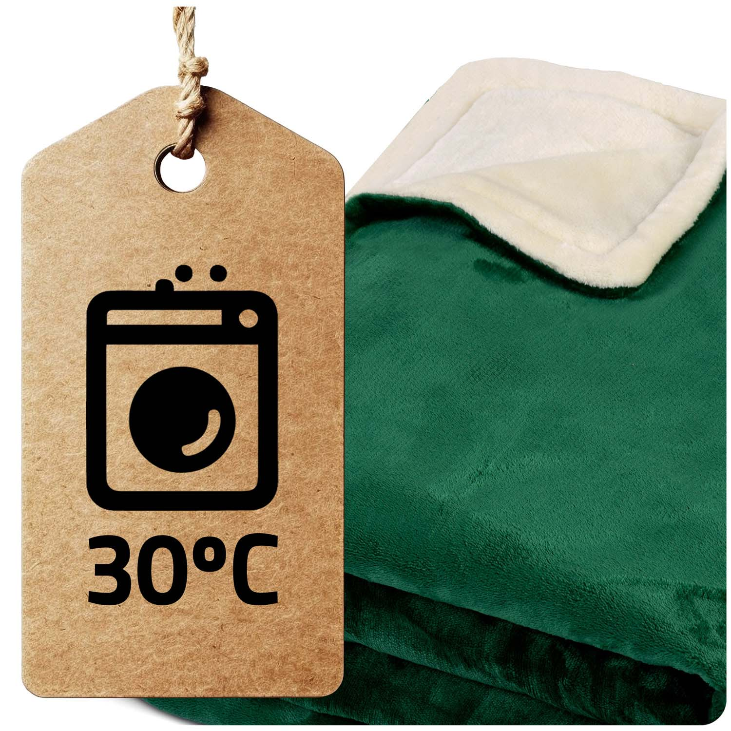 Zielony koc z białym, puszystym obramowaniem. Brązowa metka z instrukcją prania, w tym 30°C i ikoną pralki.