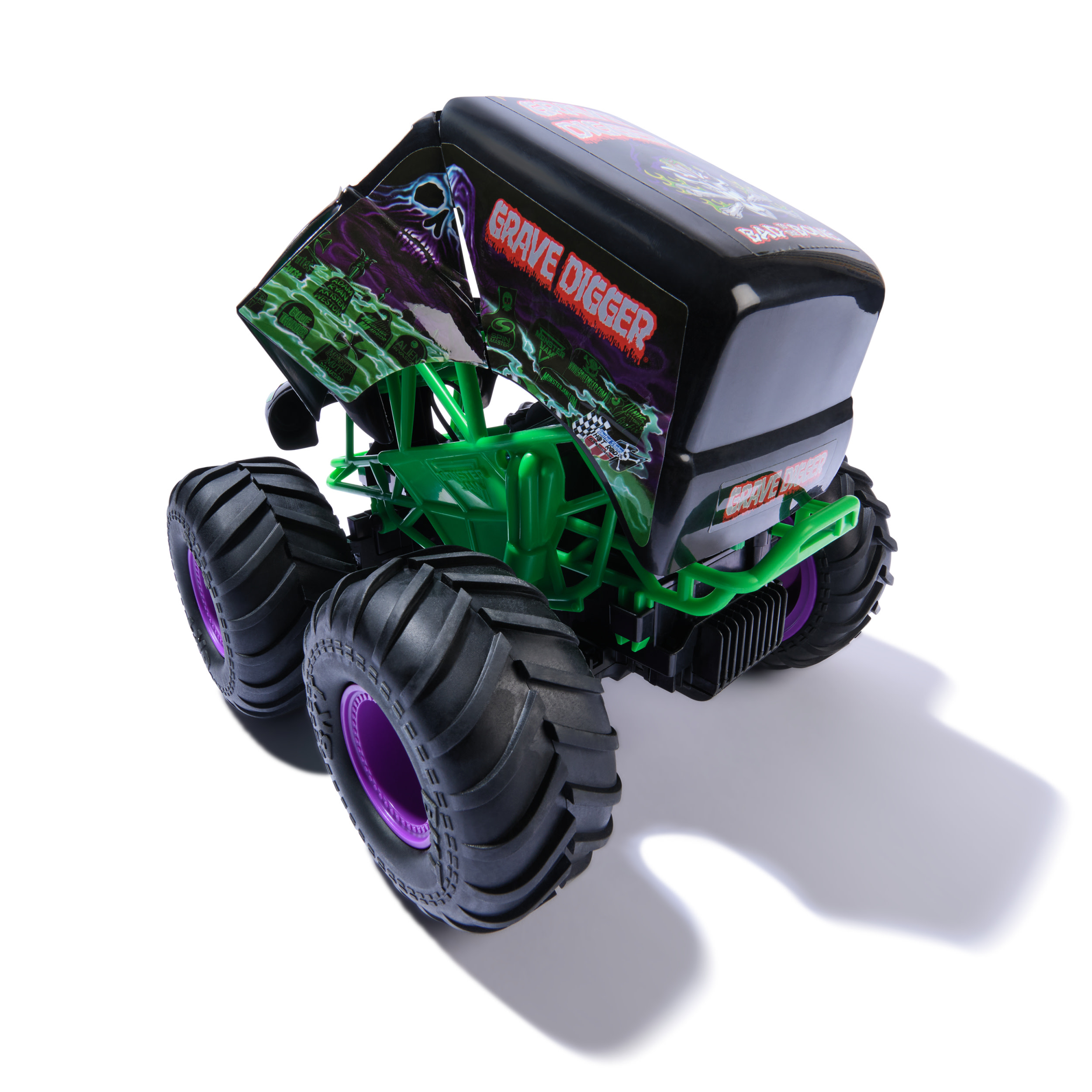 Zabawkowy monster truck, czarny z zielonymi i fioletowymi detalami, z marką 'Grave Digger'.