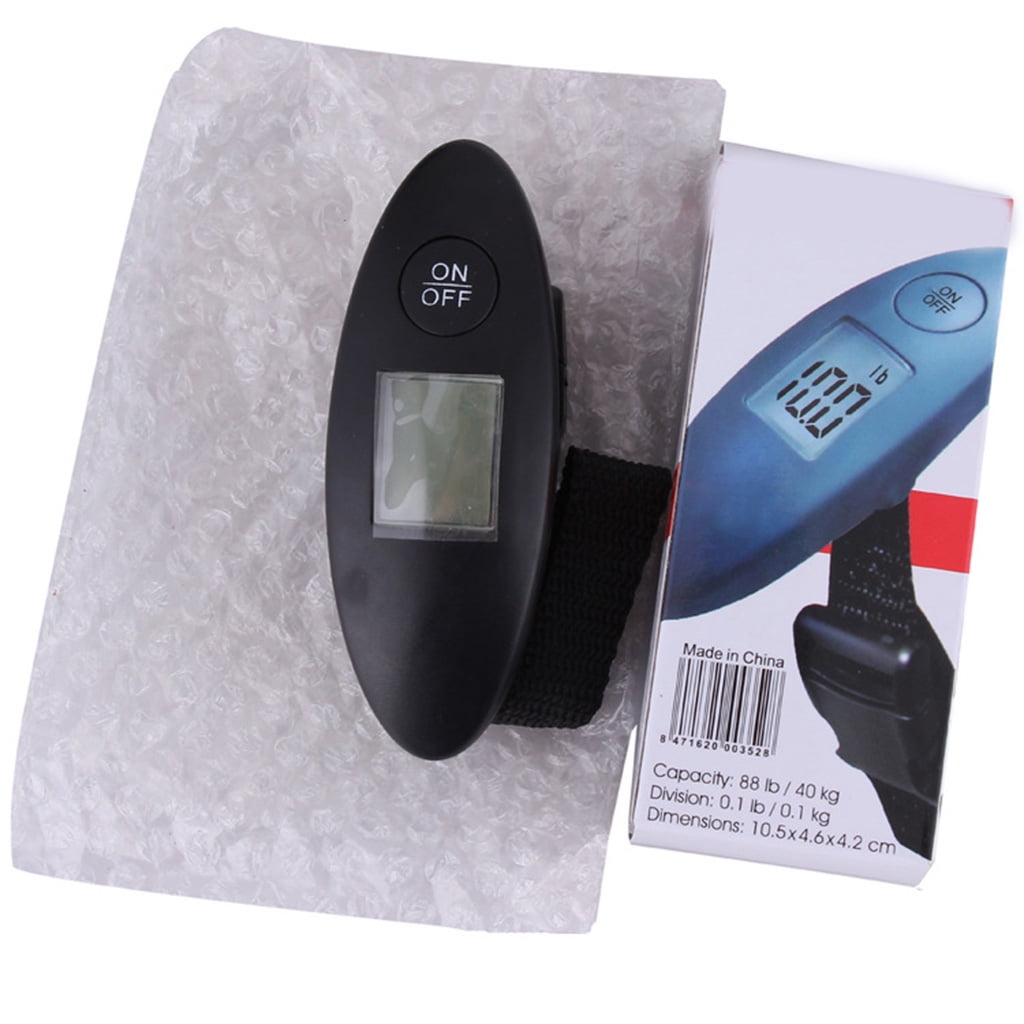 Eine schwarze Gepäckwaage mit Digitalanzeige, die 10,0 lb anzeigt. Sie befindet sich neben einer Schachtel mit einem ähnlichen Waagenbild und Text.