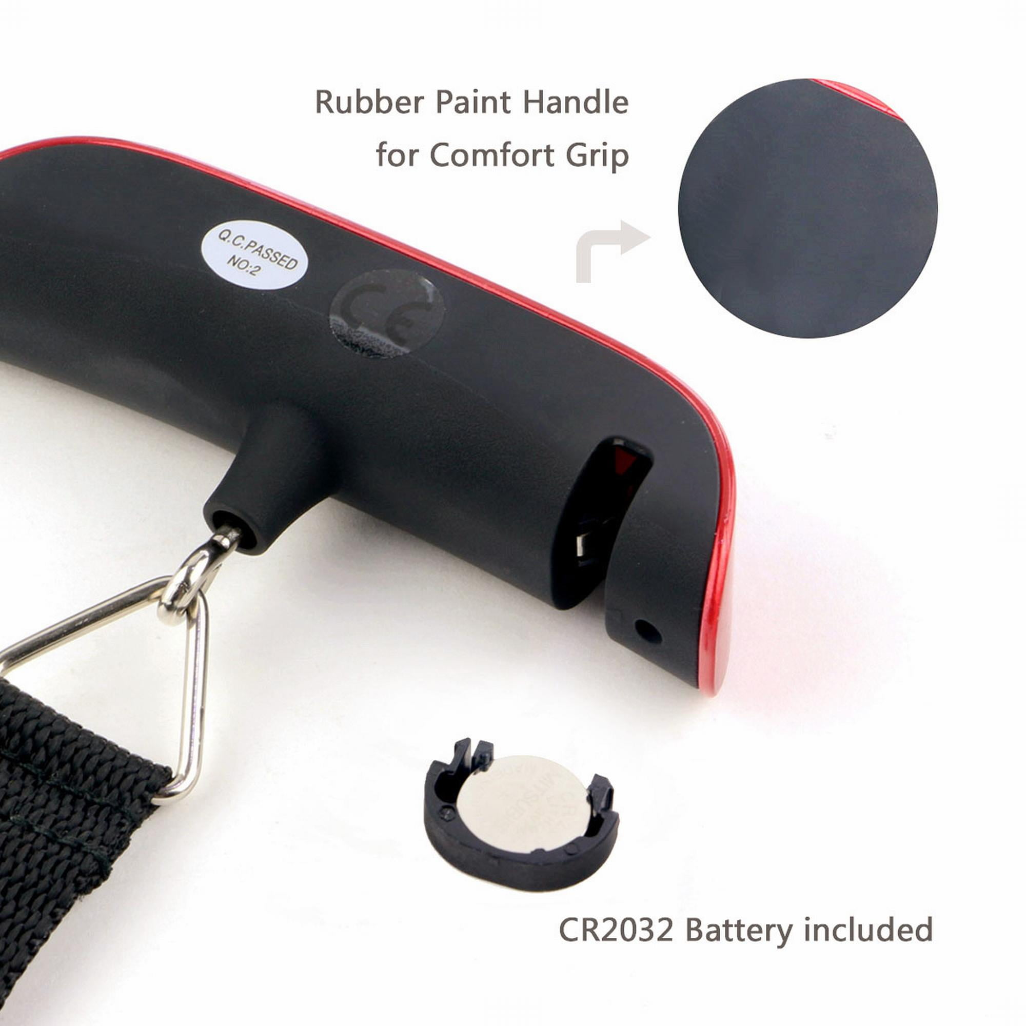 Schwarzer und roter Waagegriff mit Batterie, Metallhaken und schwarzem Gurt. Ein Aufkleber lautet "Q.C. PASSED NO:2".