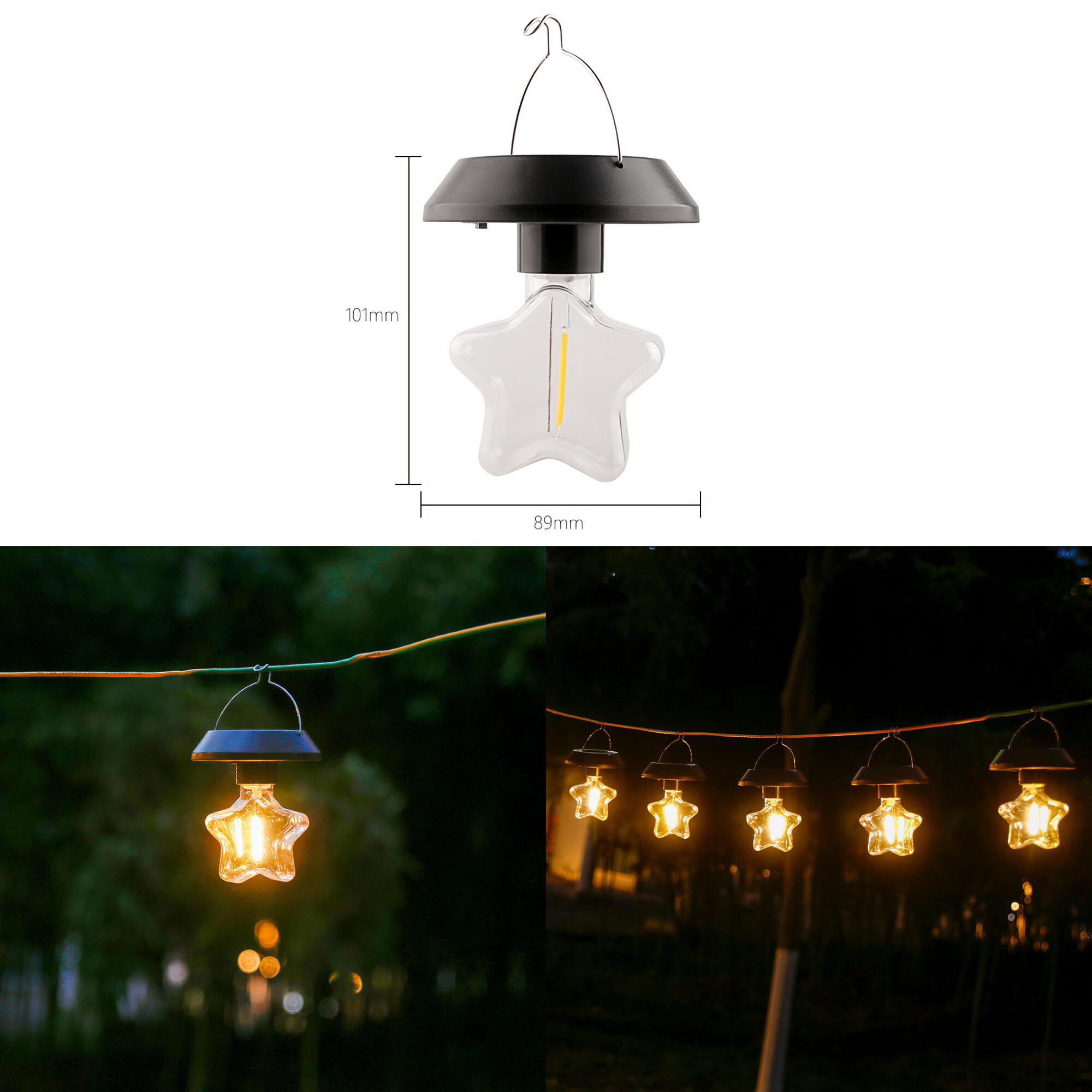 Sternförmige Solar-Laterne. Schwarze Kappe, transparenter Stern. Beleuchtete Laternen hängen an einer Schnur im Dunkeln.