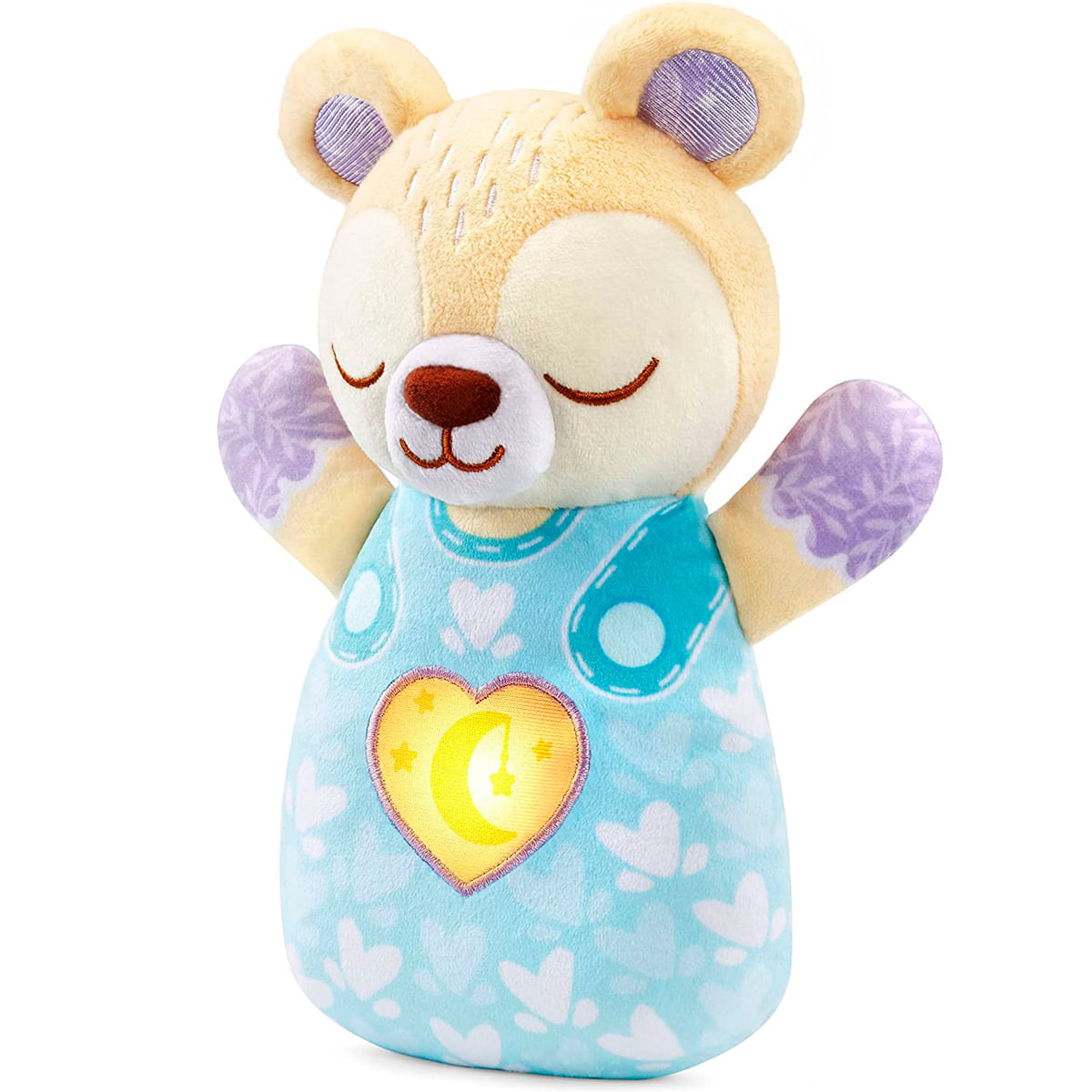 Un peluche de oso, de color marrón claro con detalles morados. Viste un atuendo azul con corazones y un corazón brillante con luna y estrellas.