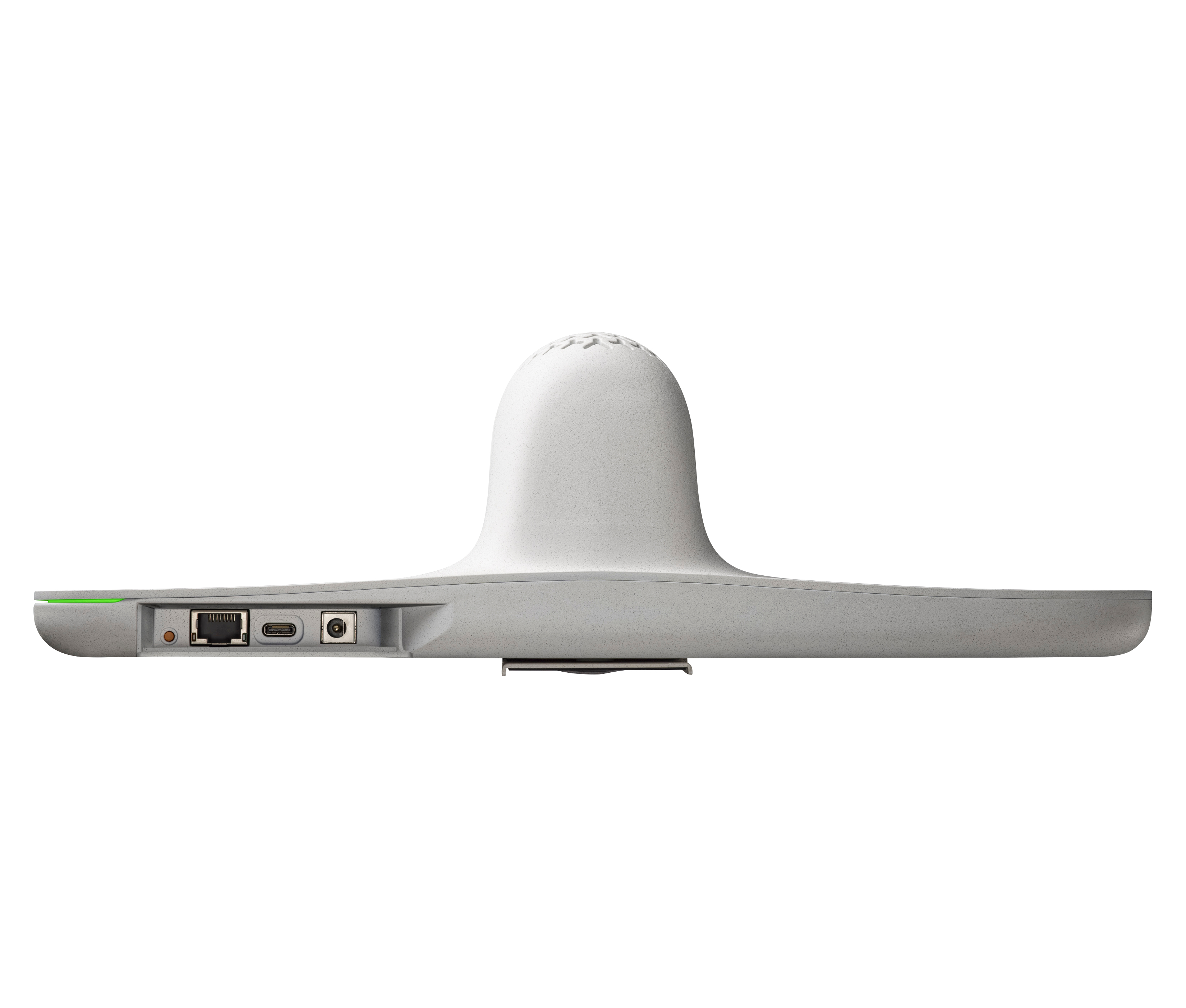 Un dispositivo grigio per videoconferenze, con porte e una struttura centrale arrotondata, su sfondo bianco.
