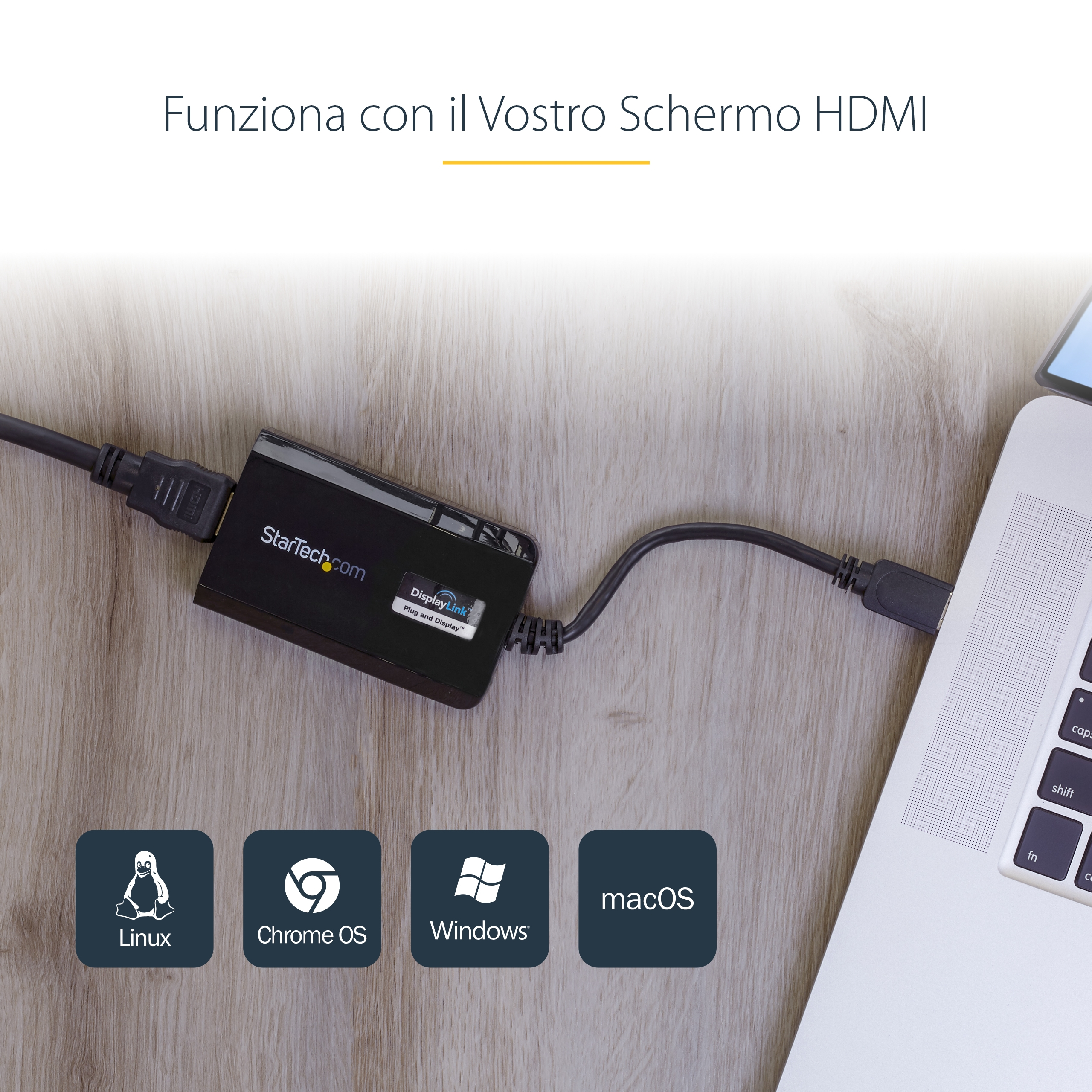 Un adaptador StarTech negro conectado a un portátil mediante un cable HDMI. Muestra iconos de Linux, Chrome OS, Windows y macOS.