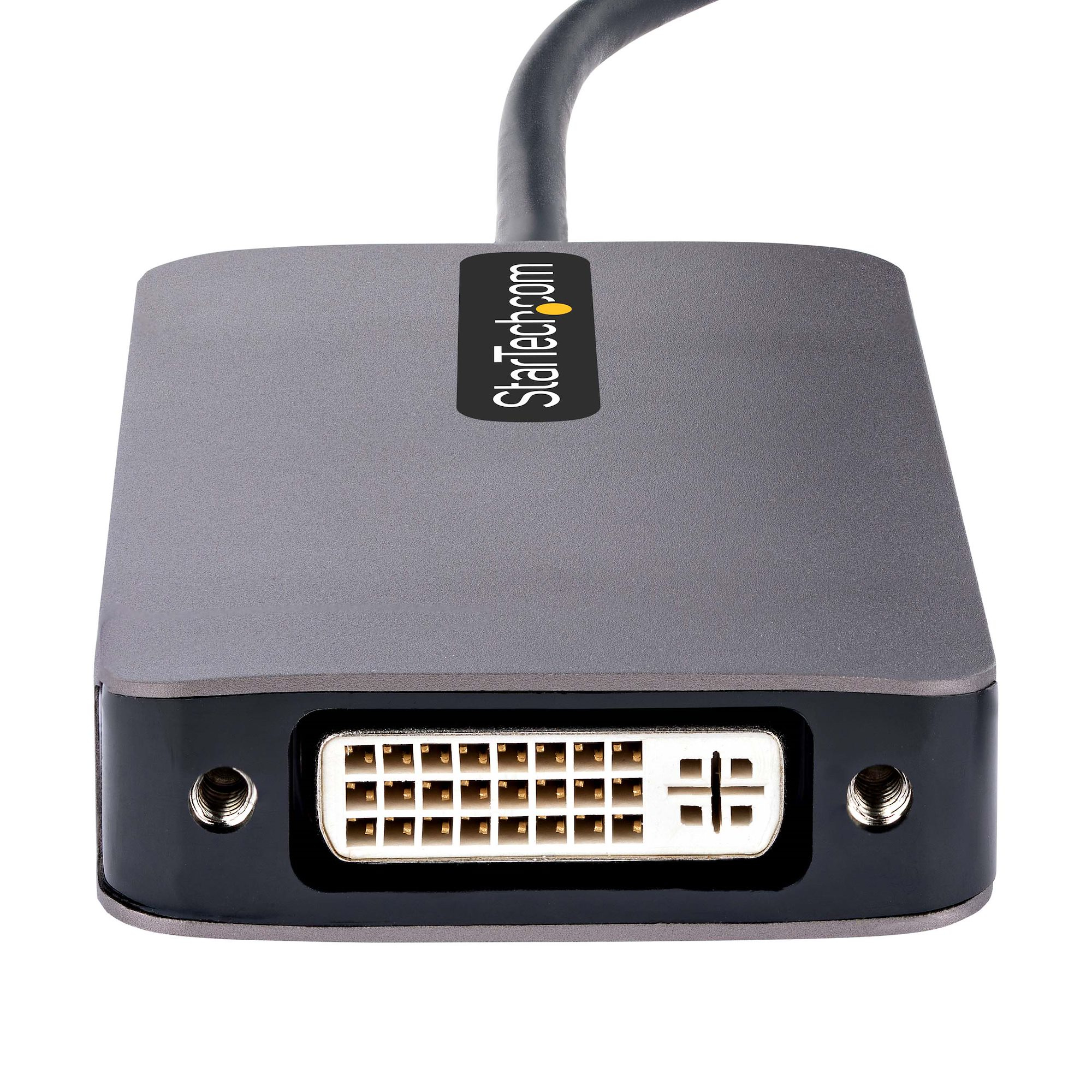 Un adaptador DVI gris StarTech con conector negro y cable gris, sobre fondo blanco.