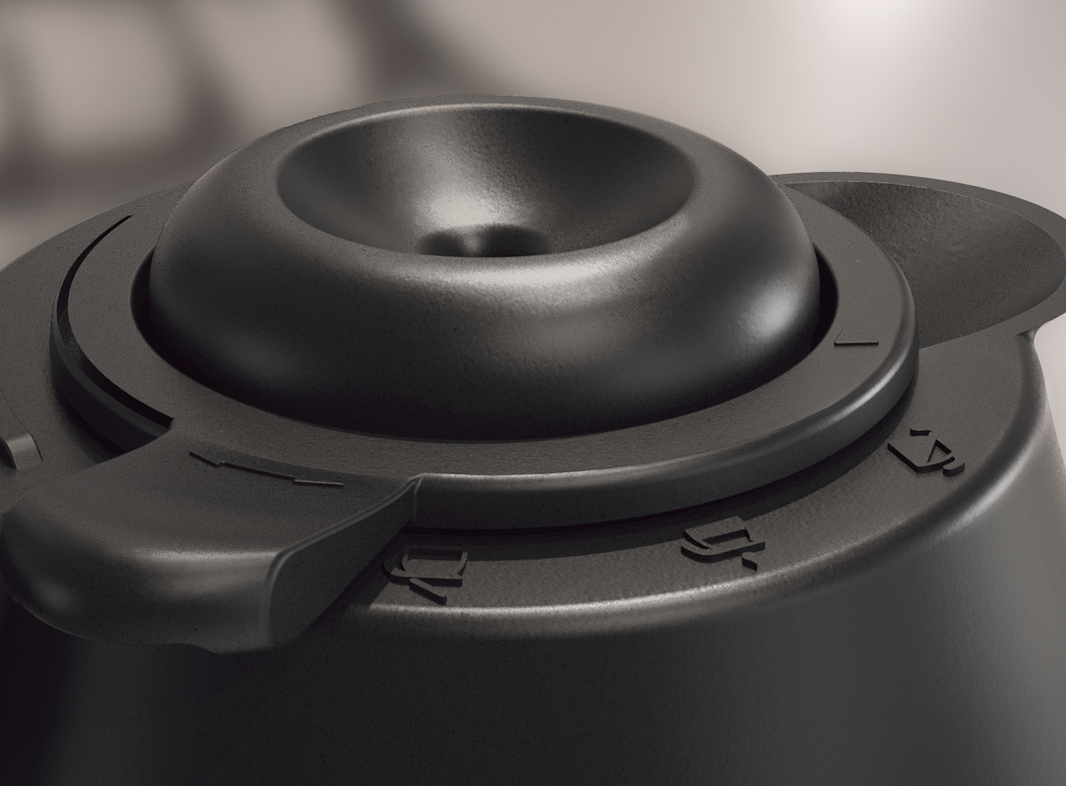 Zbliżenie czarnego obiektu z okrągłym wierzchem i pokrętłem. Widoczne liczby i symbole. Tło jest rozmyte.