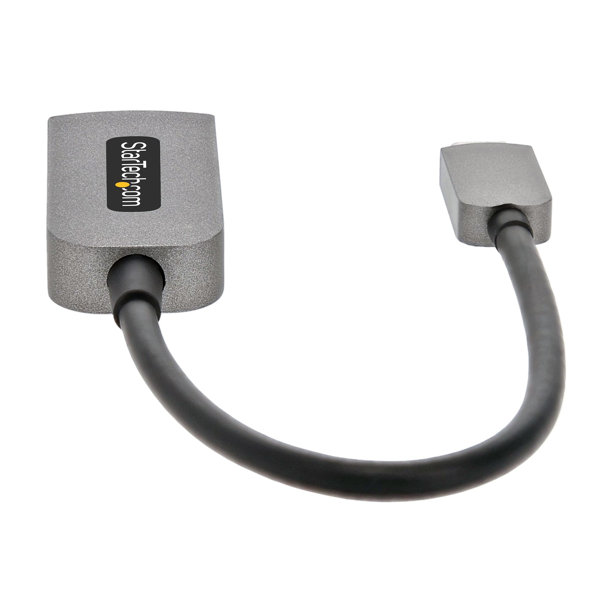 Un adaptador gris StarTech con cable negro. Aislado sobre fondo blanco. El cable forma una U.