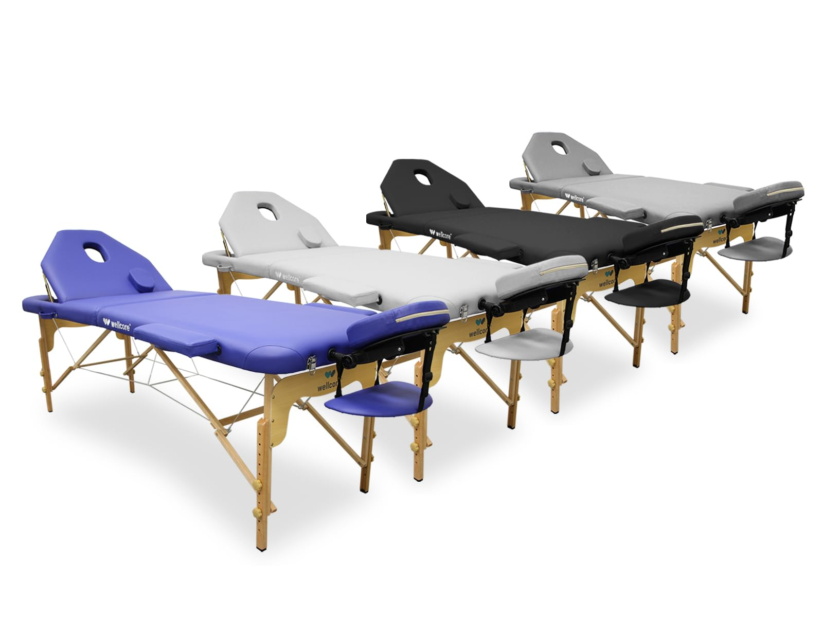 Cuatro mesas de masaje en diferentes colores: azul, blanco, negro y gris. Cada una tiene un reposacabezas y una silla lateral.