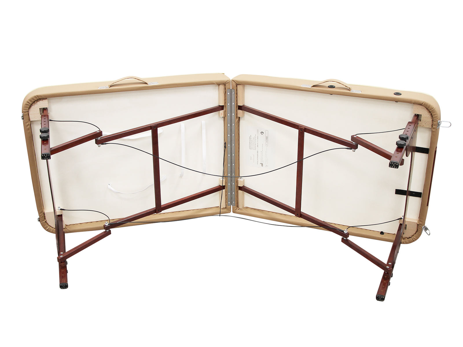 Una mesa de masaje beige está abierta, mostrando la parte inferior con soportes de madera marrón oscuro, superficie crema y cables negros.