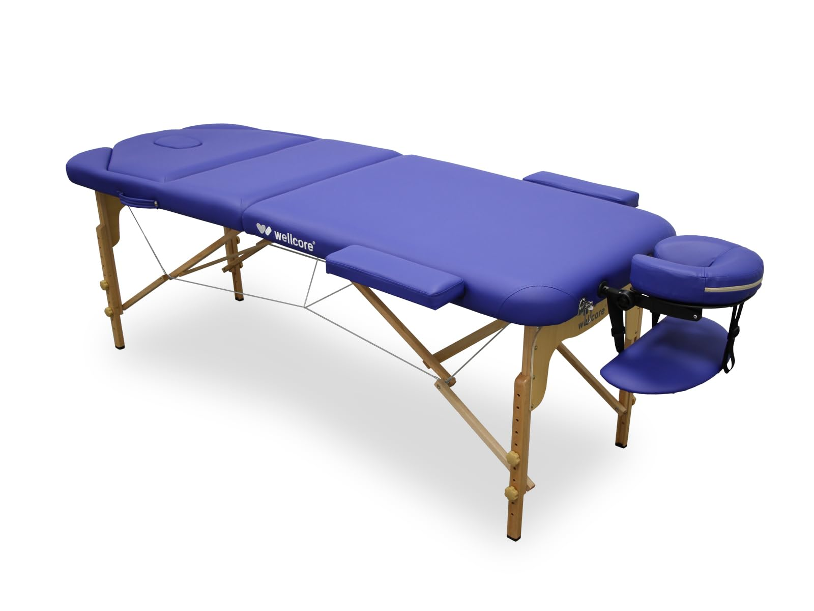 Una camilla de masaje azul, marca wellcore, con patas de madera y reposacabezas ajustable, sobre fondo blanco.