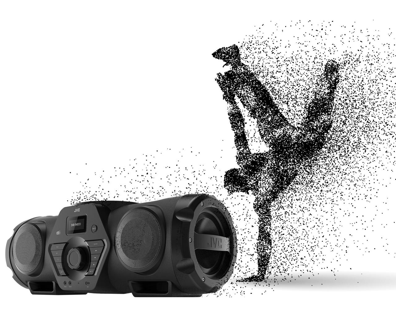 Schwarzer JVC-Lautsprecher mit einer schwarzen Silhouette eines Breakdancers rechts. Weißer Hintergrund. Punkte bilden den Tänzer.