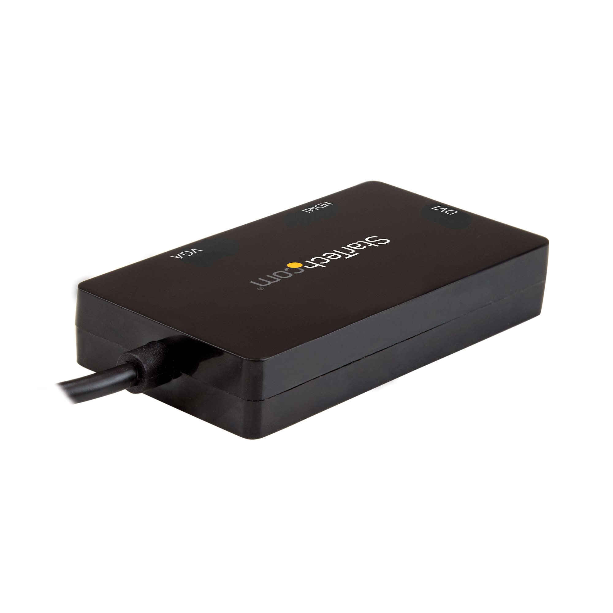 Adaptador StarTech negro con puertos VGA, HDMI y DVI. Un cable negro conectado. Fondo blanco.