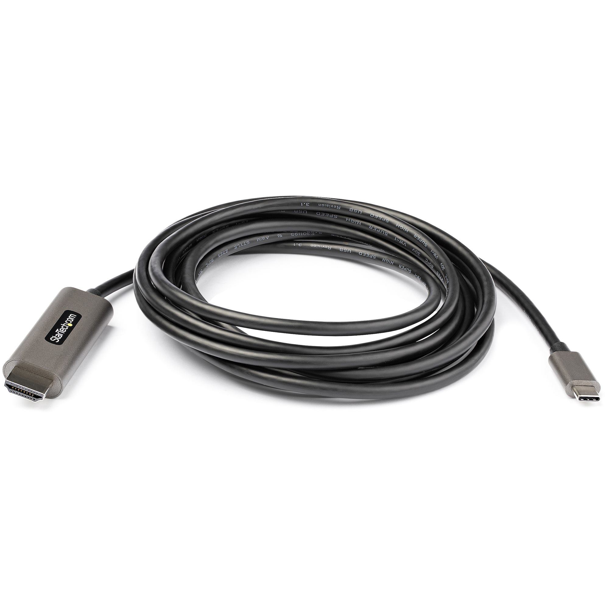 Un cable negro StarTech HDMI a USB-C enrollado sobre una superficie blanca. Los conectores son grises.