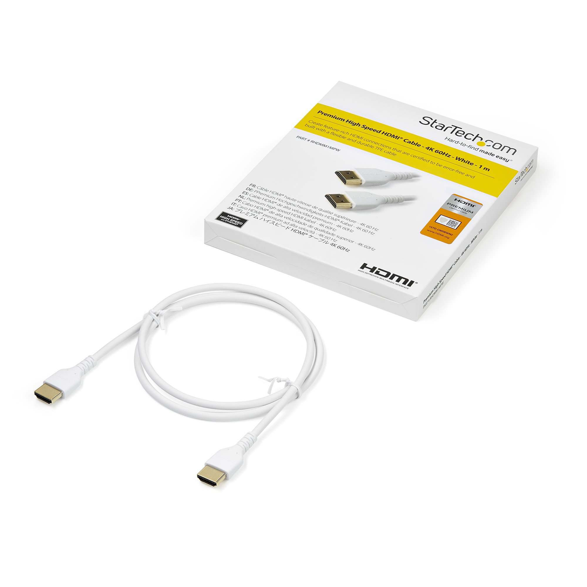 Cable HDMI blanco con conectores dorados, junto a su embalaje. La caja tiene texto y el logotipo de StarTech.com.