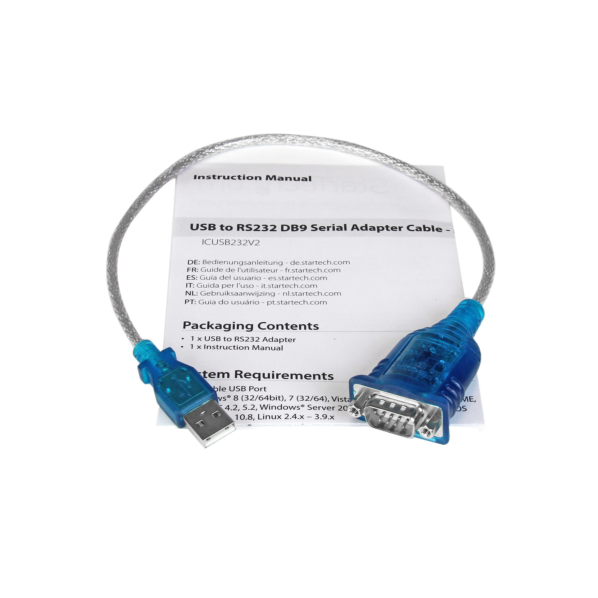 Un cable adaptador USB a RS232 azul, con un manual de instrucciones blanco al fondo, sobre una superficie blanca.