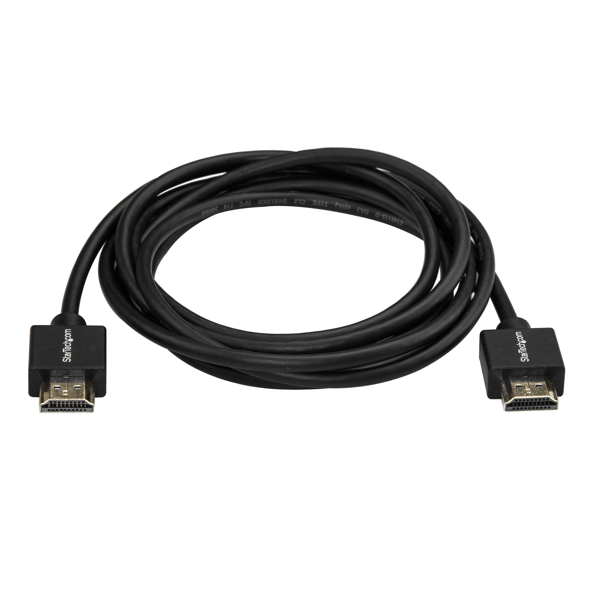 Un cable HDMI negro sobre una superficie blanca. Dos conectores en los extremos.