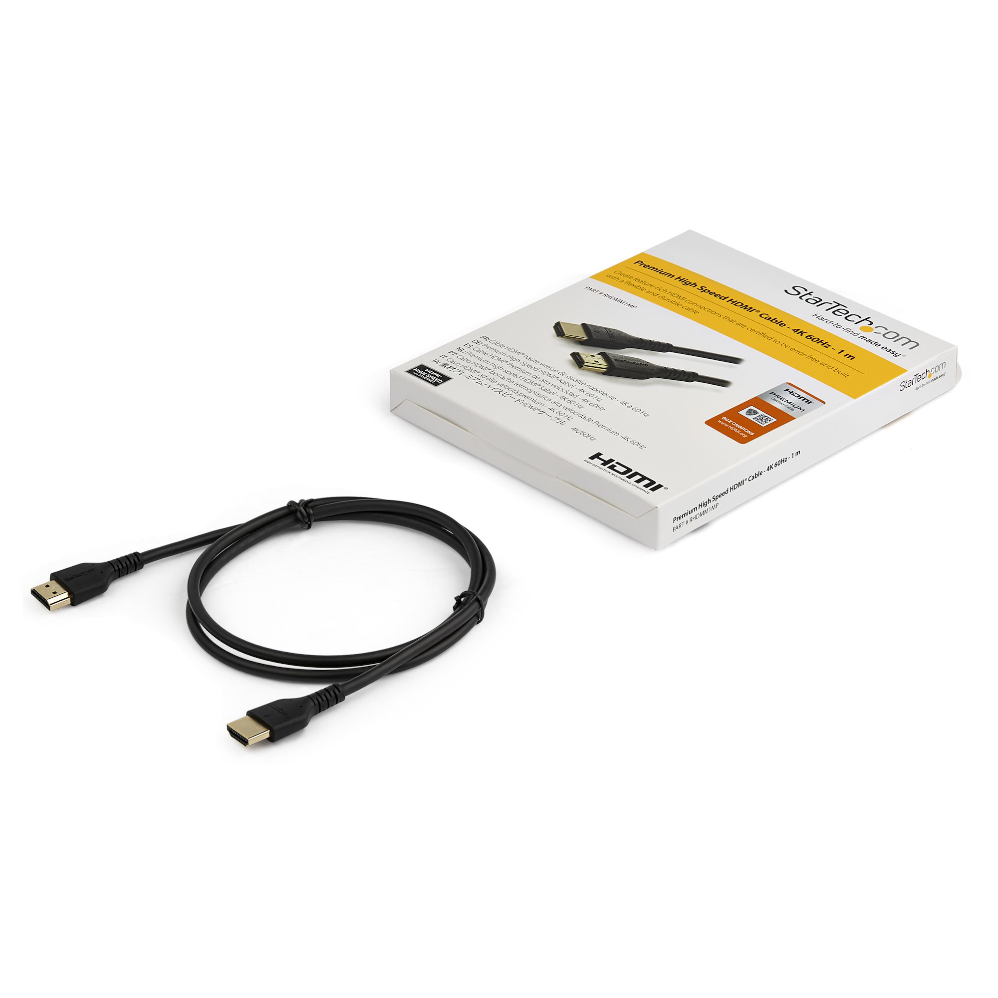 Cable HDMI negro con conectores, y una caja blanca con texto, foto del producto sobre fondo blanco.