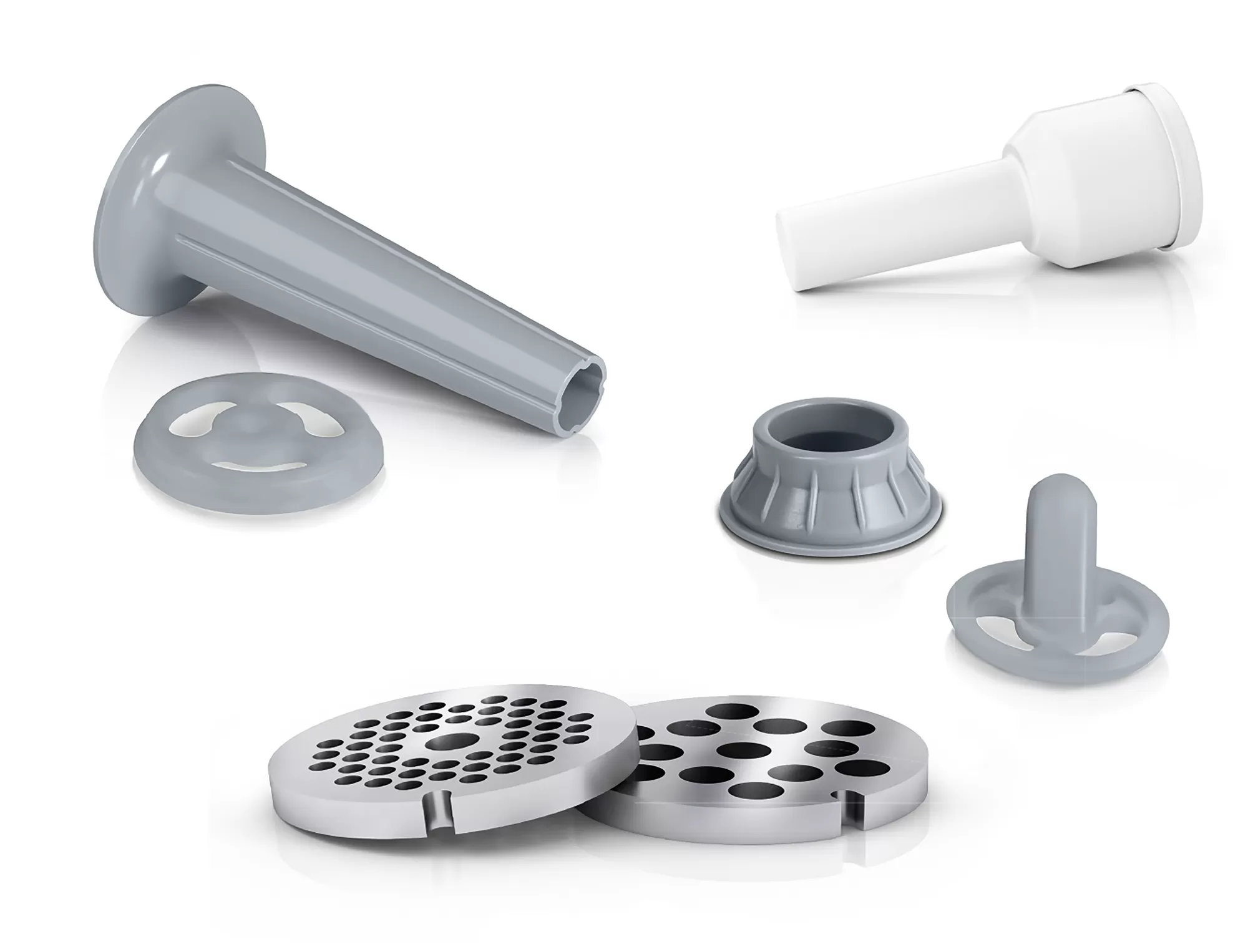 Różne szare i białe części maszynki do mięsa ułożone na białym tle. Zawiera płyty, rury i lejek.