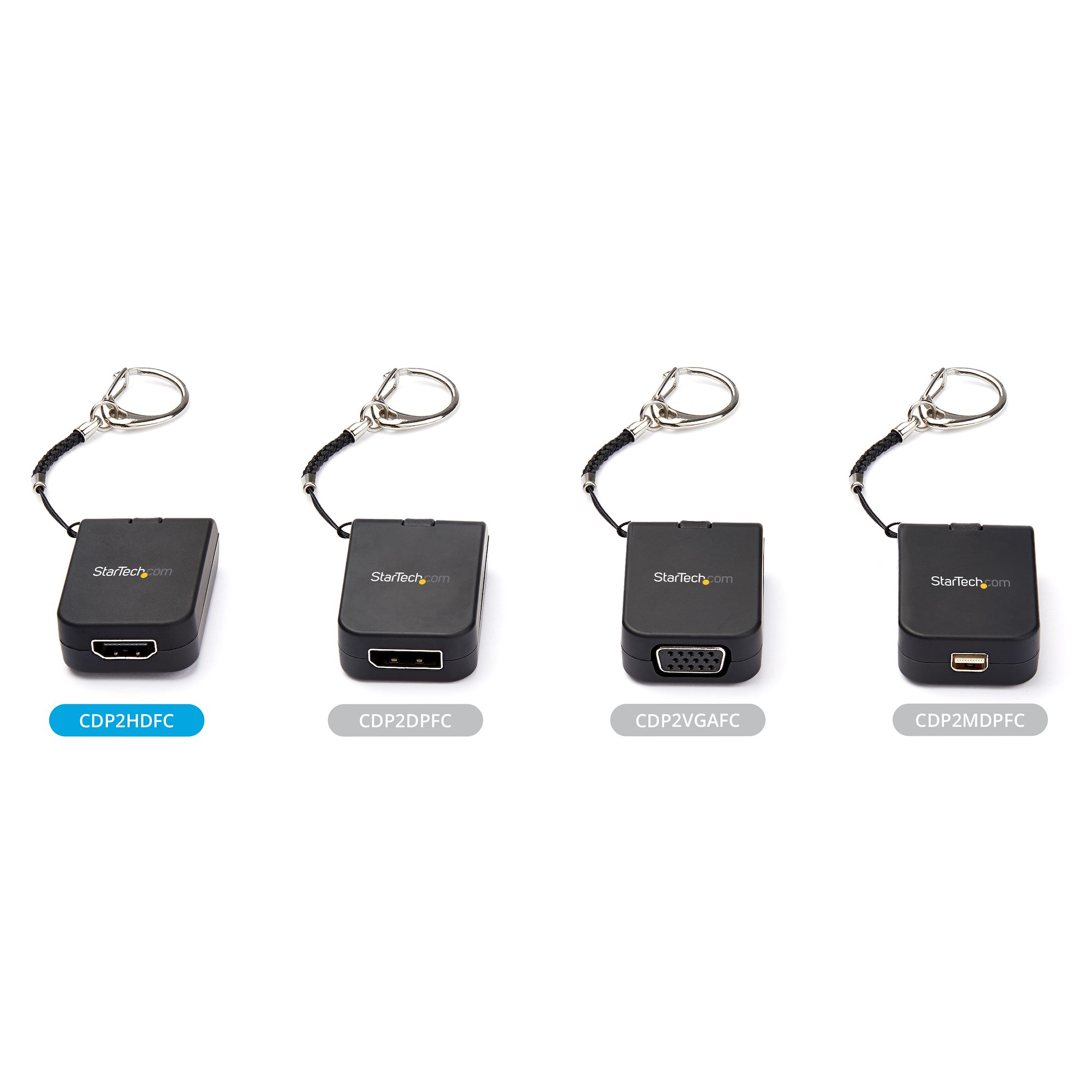 Cuatro adaptadores negros con llaveros. Cada uno tiene un puerto diferente: HDMI, DVI, VGA y Mini-DisplayPort, y el logotipo de StarTech.com.