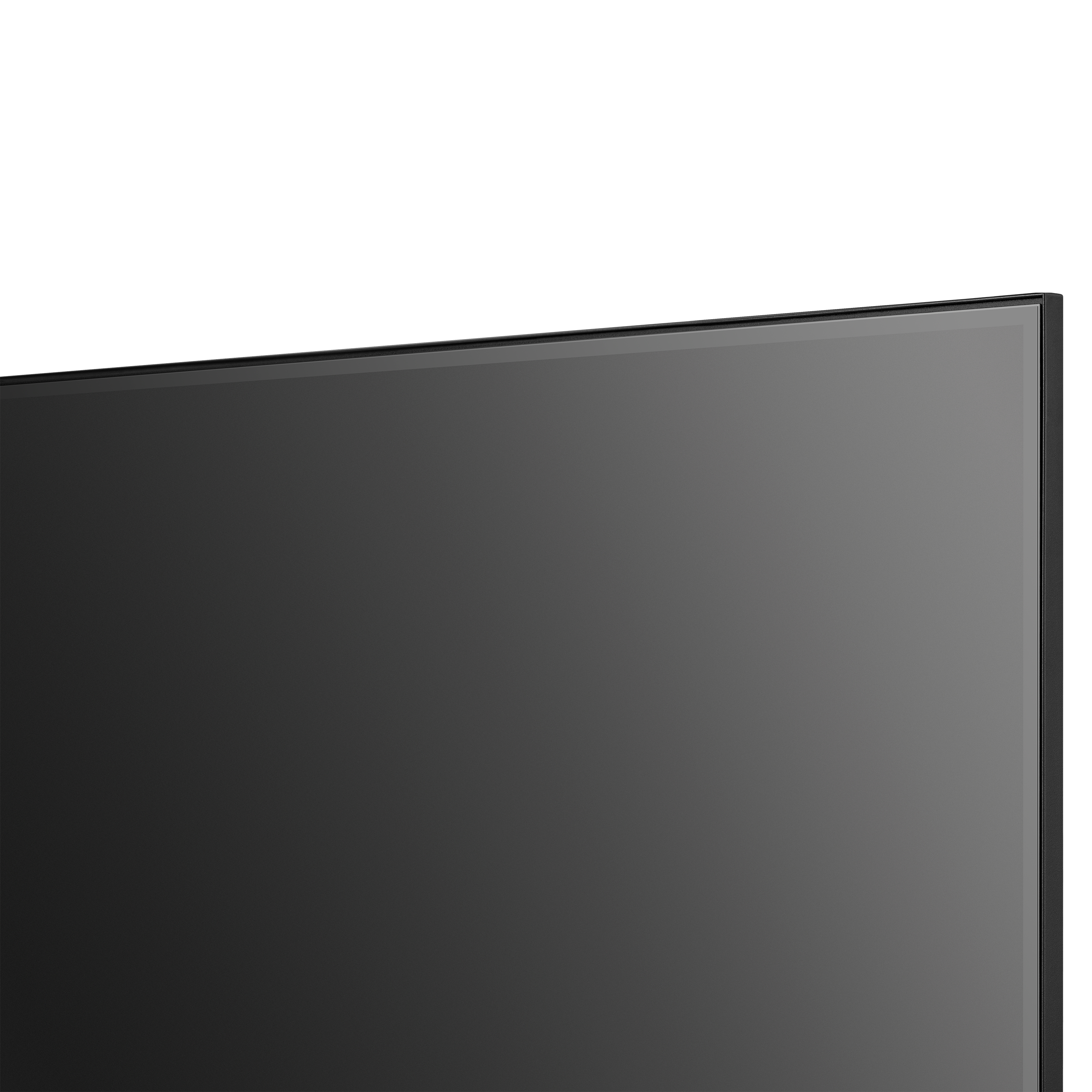 Primer plano de un televisor de pantalla plana negro. La pantalla es gris oscuro, con marco negro y fondo blanco.