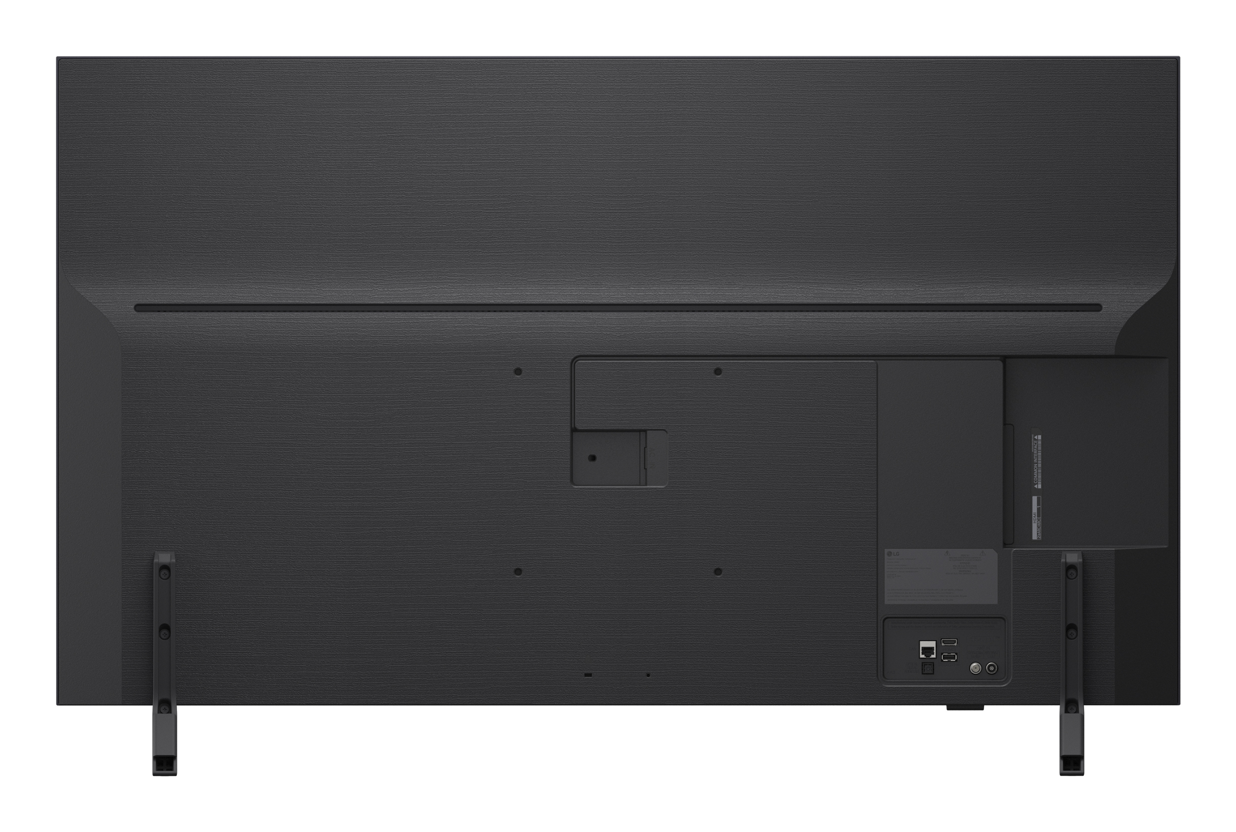Widok z tyłu czarnego telewizora z portami i podstawą. Teksturowana powierzchnia, porty na dole, dwie nogi.