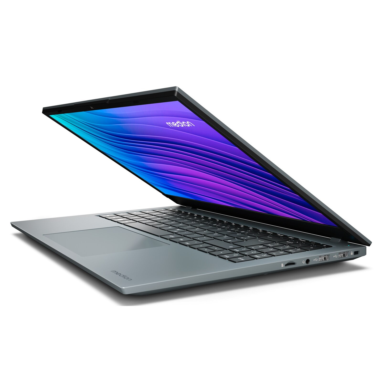 Una laptop Medion gris está abierta, mostrando el teclado y la pantalla. La pantalla muestra un diseño púrpura abstracto.