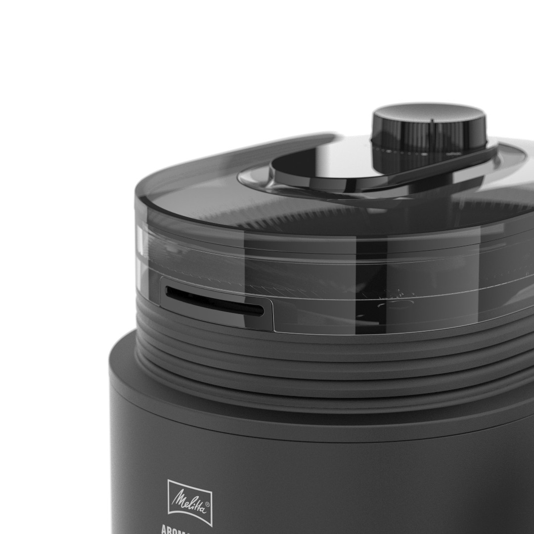 Zbliżenie czarnego młynka do kawy Melitta. Młynek ma przezroczystą górę, czarny guzik i logo Melitta.
