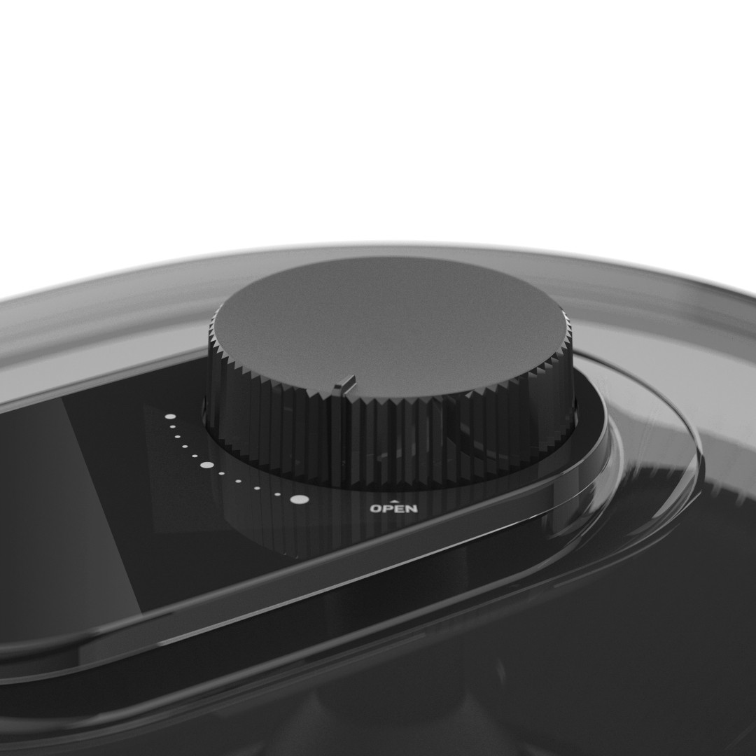 Zbliżenie czarnego pokrętła na ciemnej powierzchni. Pokrętło ma napis 'OPEN'. Białe kropki wskazują ustawienia. Tło jest białe.