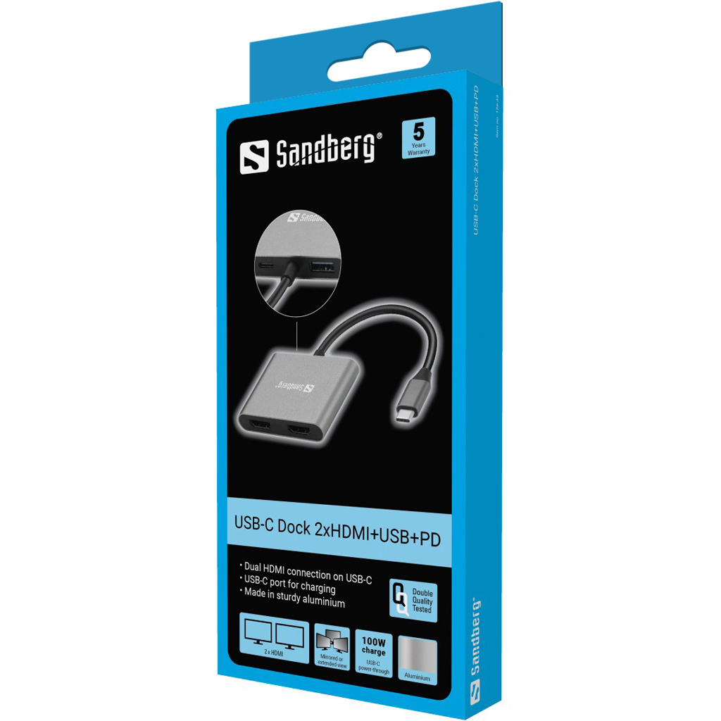Ein Sandberg USB-C-Dock in der Verpackung. Es hat zwei HDMI-Anschlüsse, einen USB-C-Anschluss und USB-C PD. Die Box ist blau und weiß.