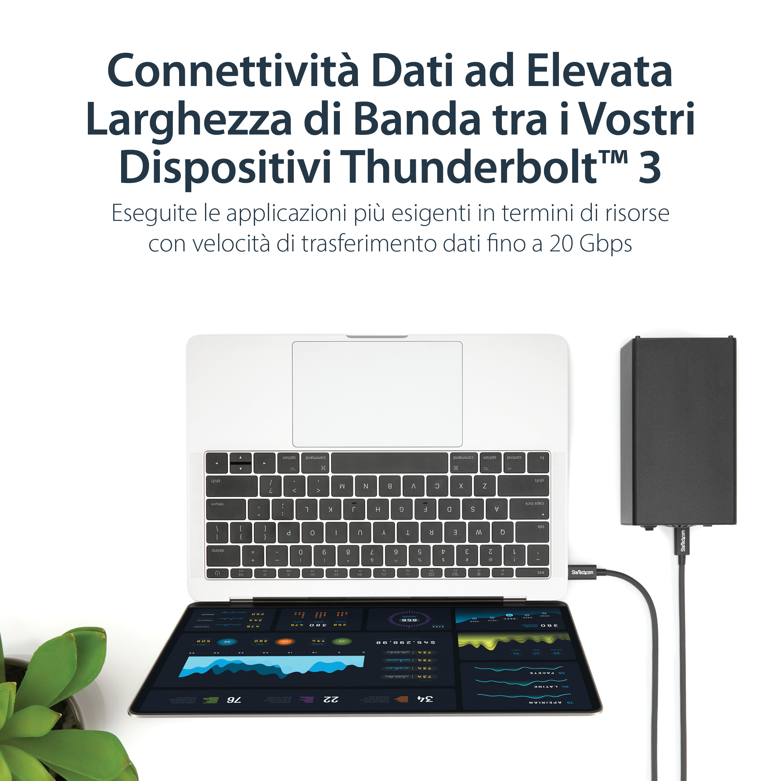 Un laptop con un tablet collegato che mostra dati. Un dispositivo di archiviazione dati nero è collegato.