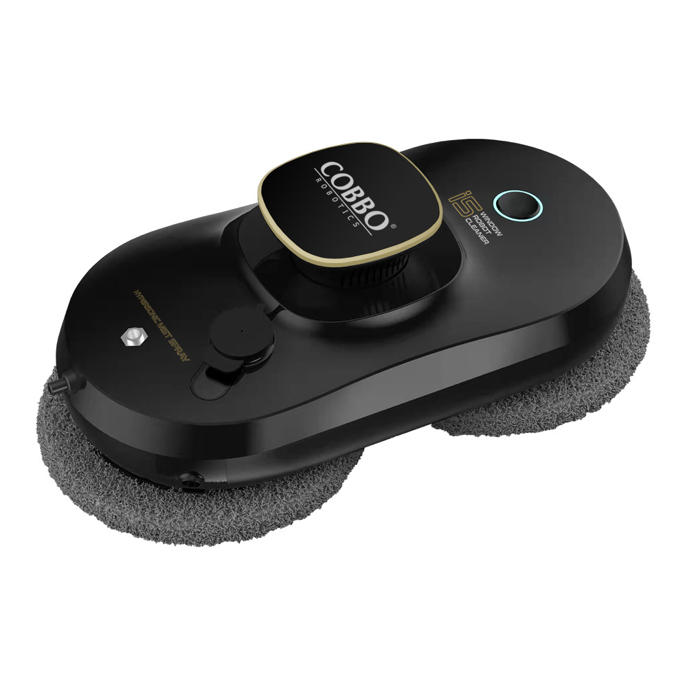 Czarny robot do czyszczenia okien z szarymi podkładkami. Ma czarny kwadratowy wierzch ze złotym obramowaniem i marką 'COBBO Robotics'.