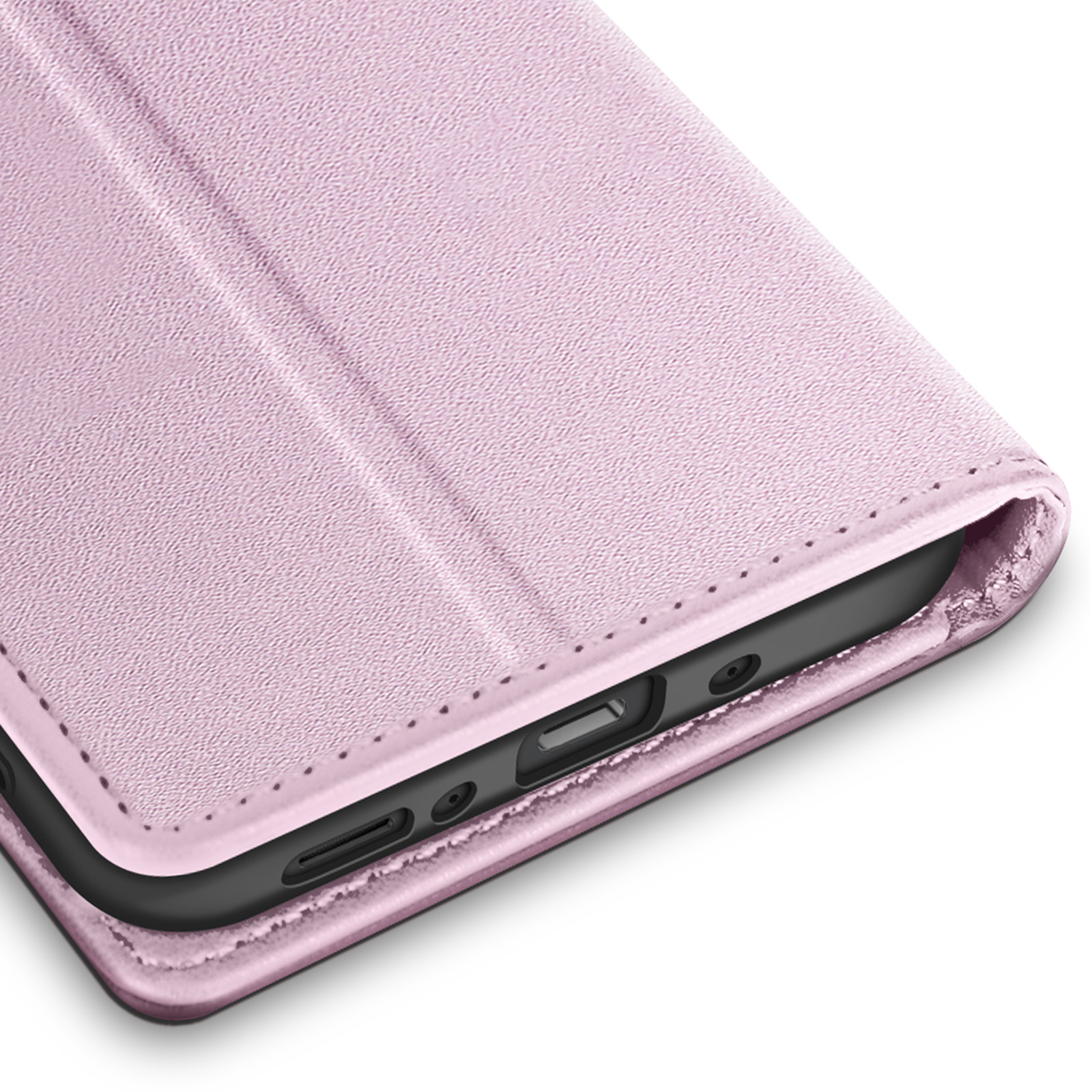 Close-up van een roze telefoonhoesje met een getextureerd oppervlak, met de oplaadpoort en knoppen van de telefoon.