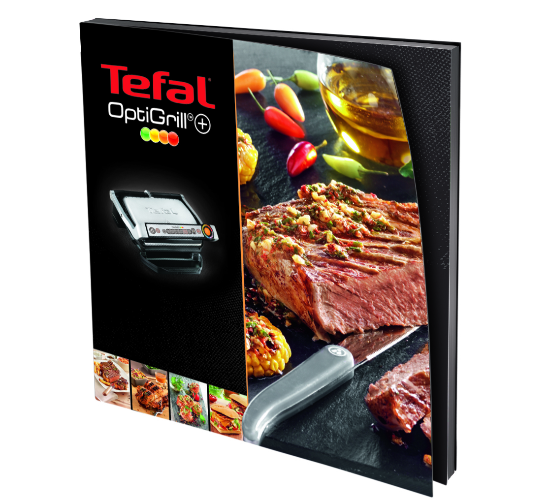Scatola Tefal OptiGrill con griglia, bistecca grigliata, mais e peperoncini. La bistecca è tagliata con un coltello.