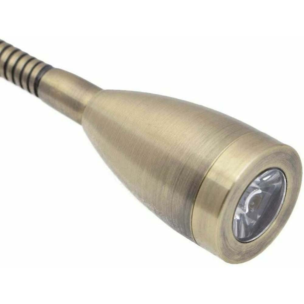 Nahaufnahme einer bronzefarbenen, verstellbaren LED-Leselampe. Das Licht ist auf den Betrachter gerichtet und zeigt die Linse.
