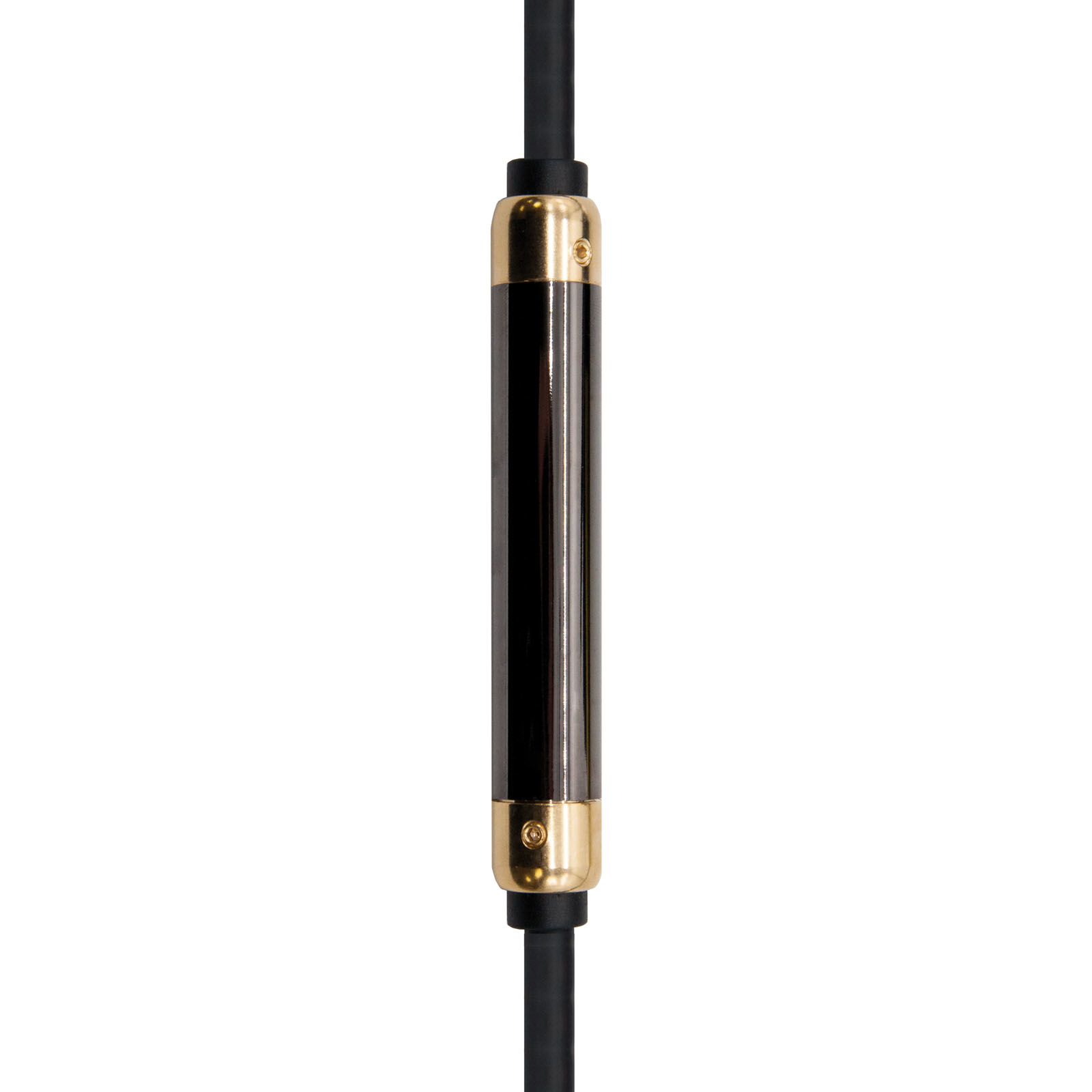 Primer plano de un objeto cilíndrico negro y dorado. Tiene dos cables negros conectados.