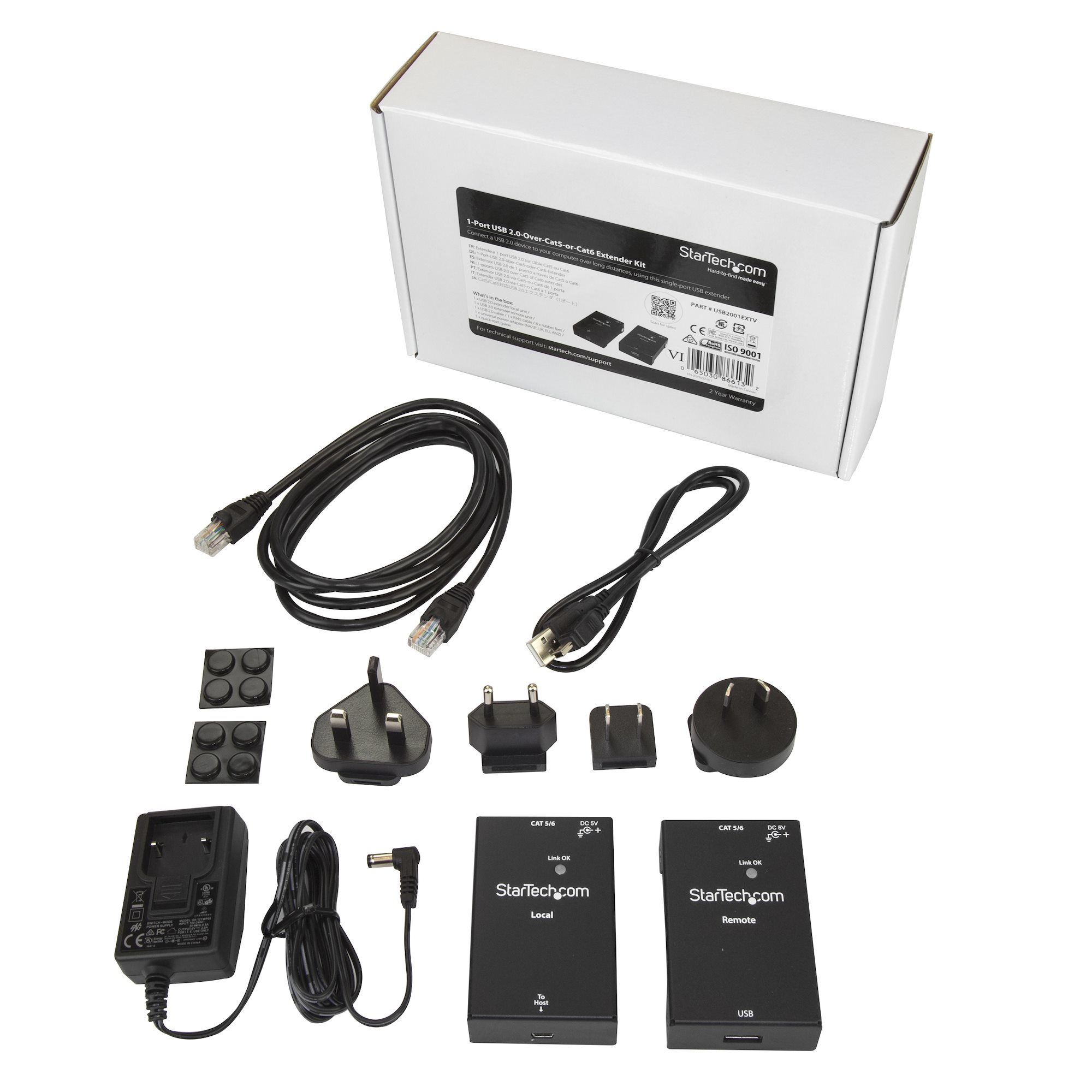 Kit con cables negros, adaptadores y dos cajas negras. Una caja blanca con texto en el fondo.