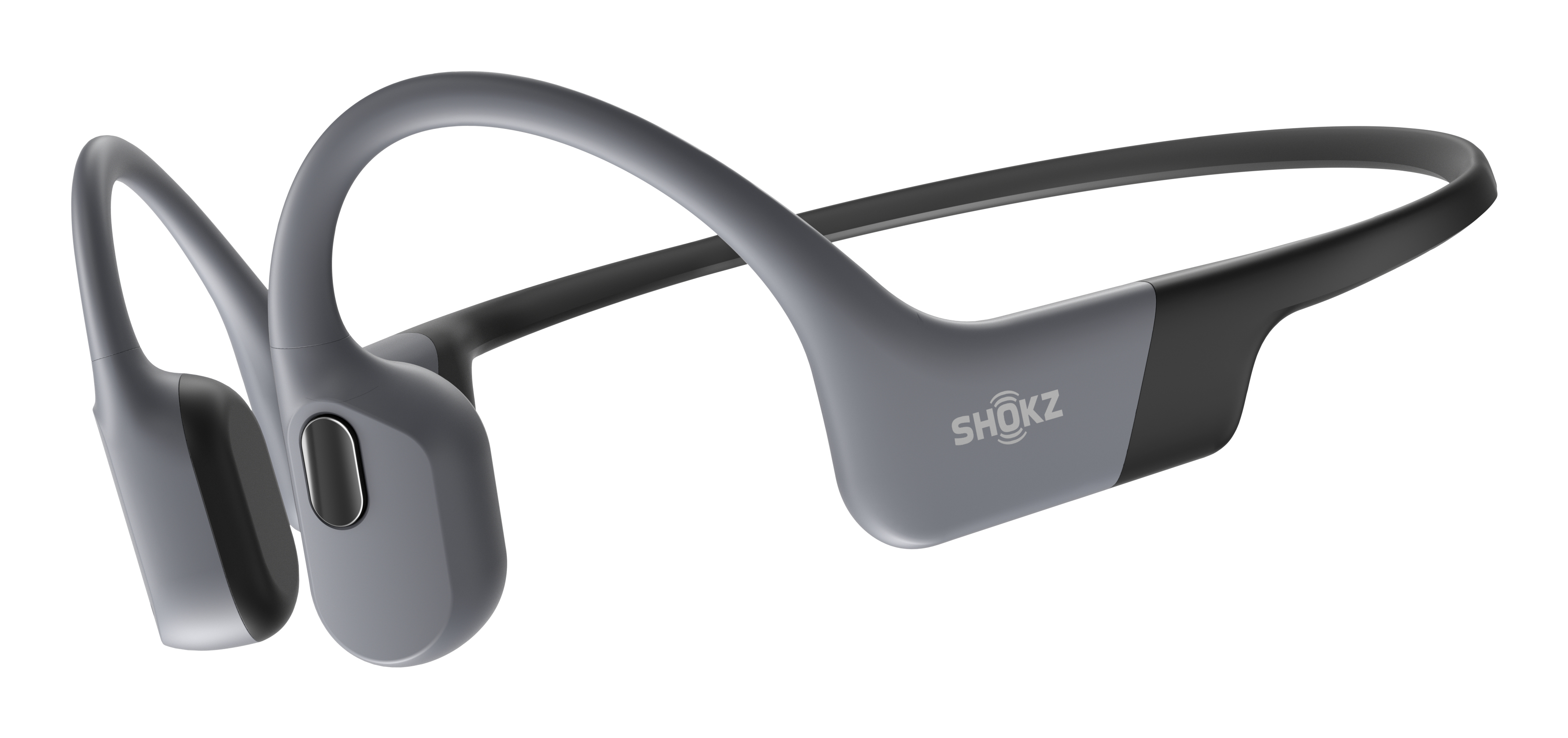 Casque à conduction osseuse Shokz gris et noir. Le logo de la marque est visible sur le côté. Le fond est blanc.