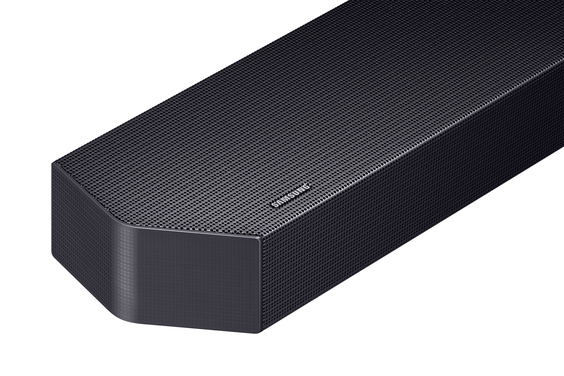Nahaufnahme einer schwarzen Samsung Soundbar. Sie ist rechteckig mit abgerundeten Ecken und perforierter Oberfläche.