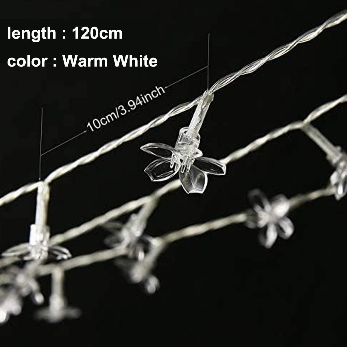 Nahaufnahme von Lichterketten mit blütenförmigen Glühbirnen. Text: Länge: 120 cm, Farbe: Warmweiß und 10 cm/3,94 Zoll.