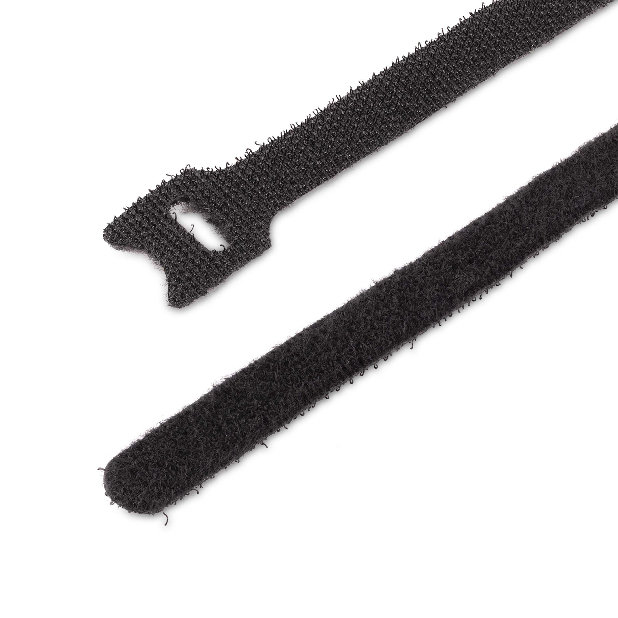 Due fascette velcro nere su sfondo bianco. Una ha una testa. Entrambe sono diagonali.