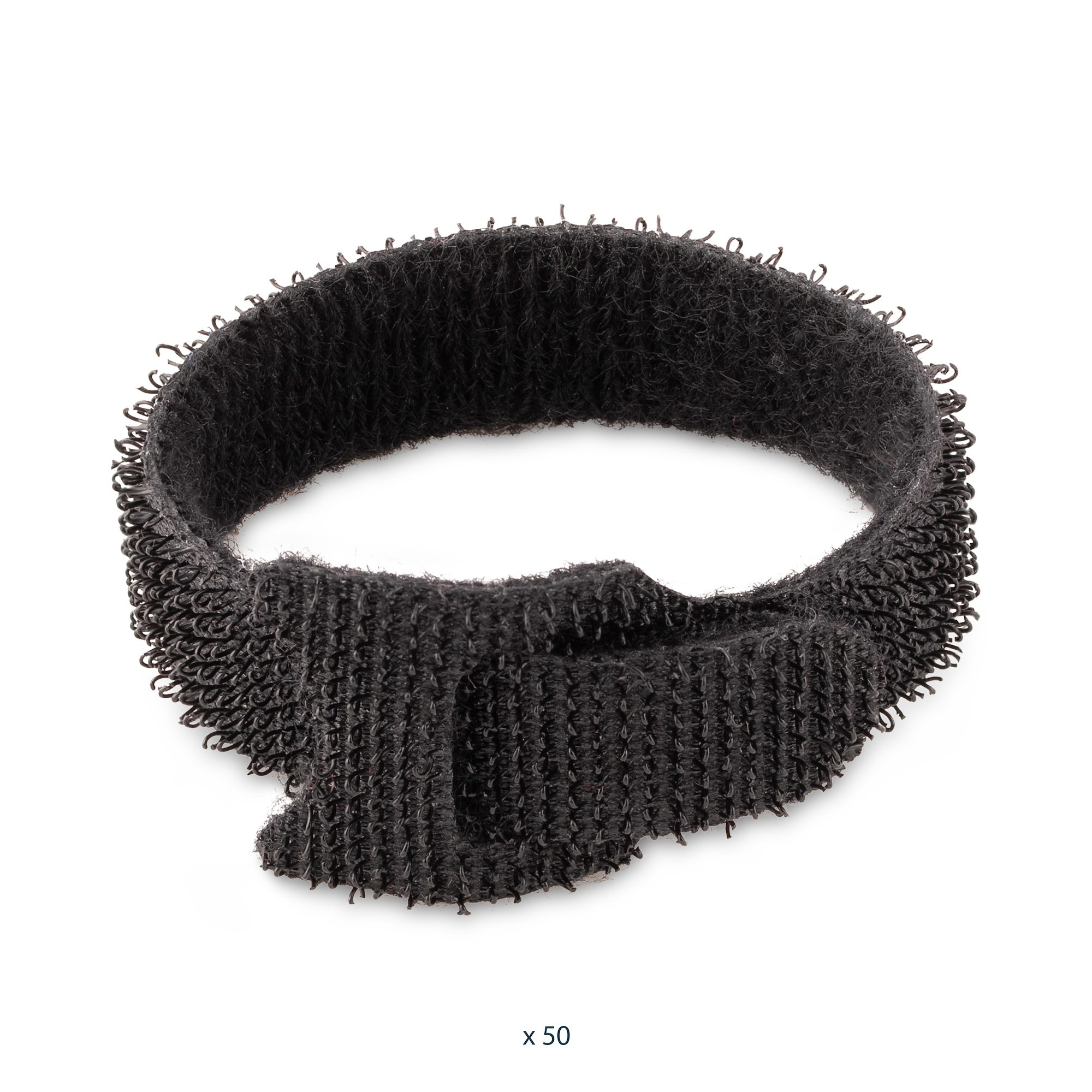 Un cinturino in velcro nero, circolare, con chiusura a strappo. Lo sfondo è bianco. Testo: x 50